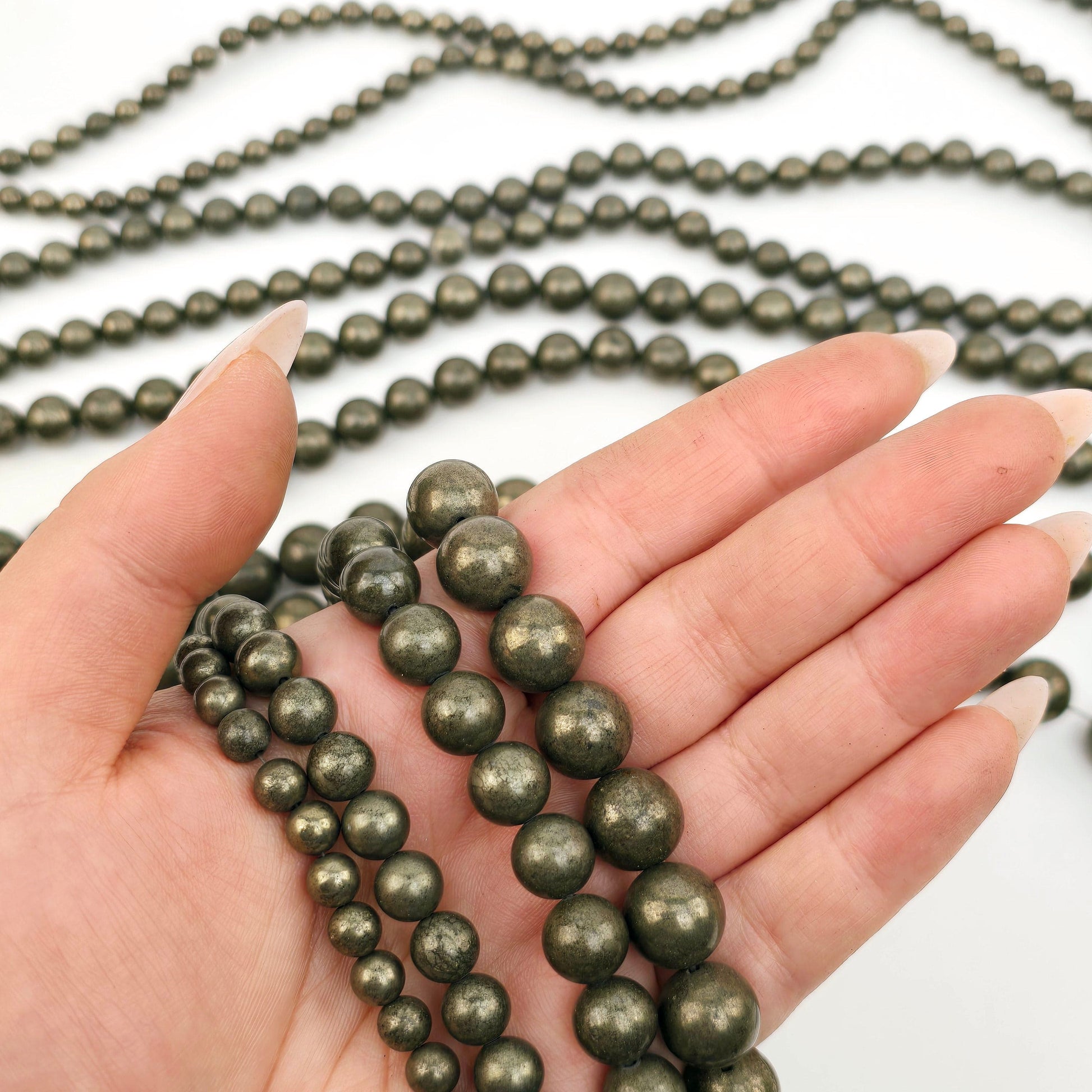 Pyrite Round Drilled Beads - 15.5" Strand - You Choose Size - all sizes in hand for size reference with more strands in the background