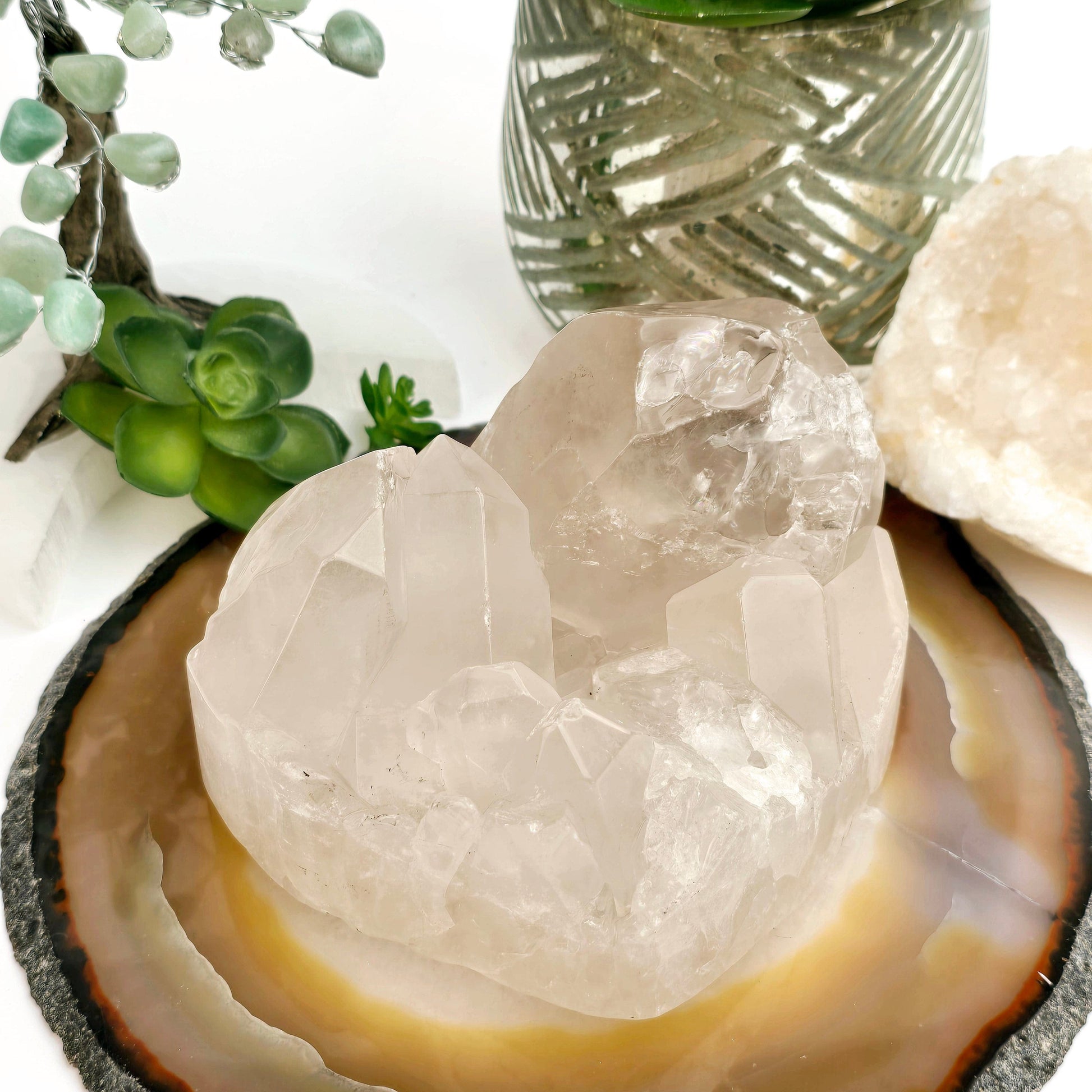 Crystal Quartz Cluster Heart - One-of-a-Kind #2 side front view with props and plants in the background