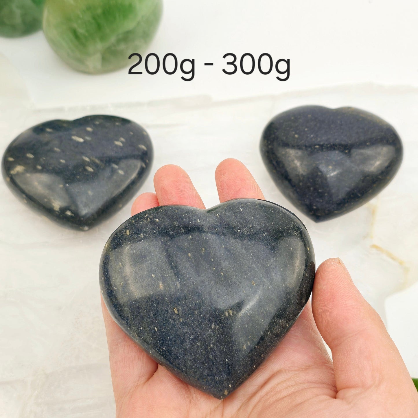 Lazulite Crystal Heart - By Weight 200g-300g weight variant labeled with oen in hand for size reference