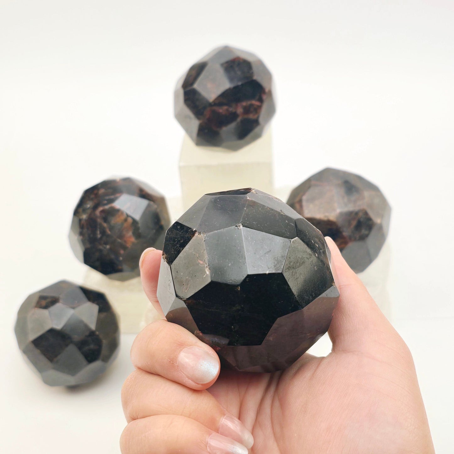 Garnet - Giant Faceted Garnet Crystal Sphere - You Choose variant 5 in hand for size reference with other variants in the background