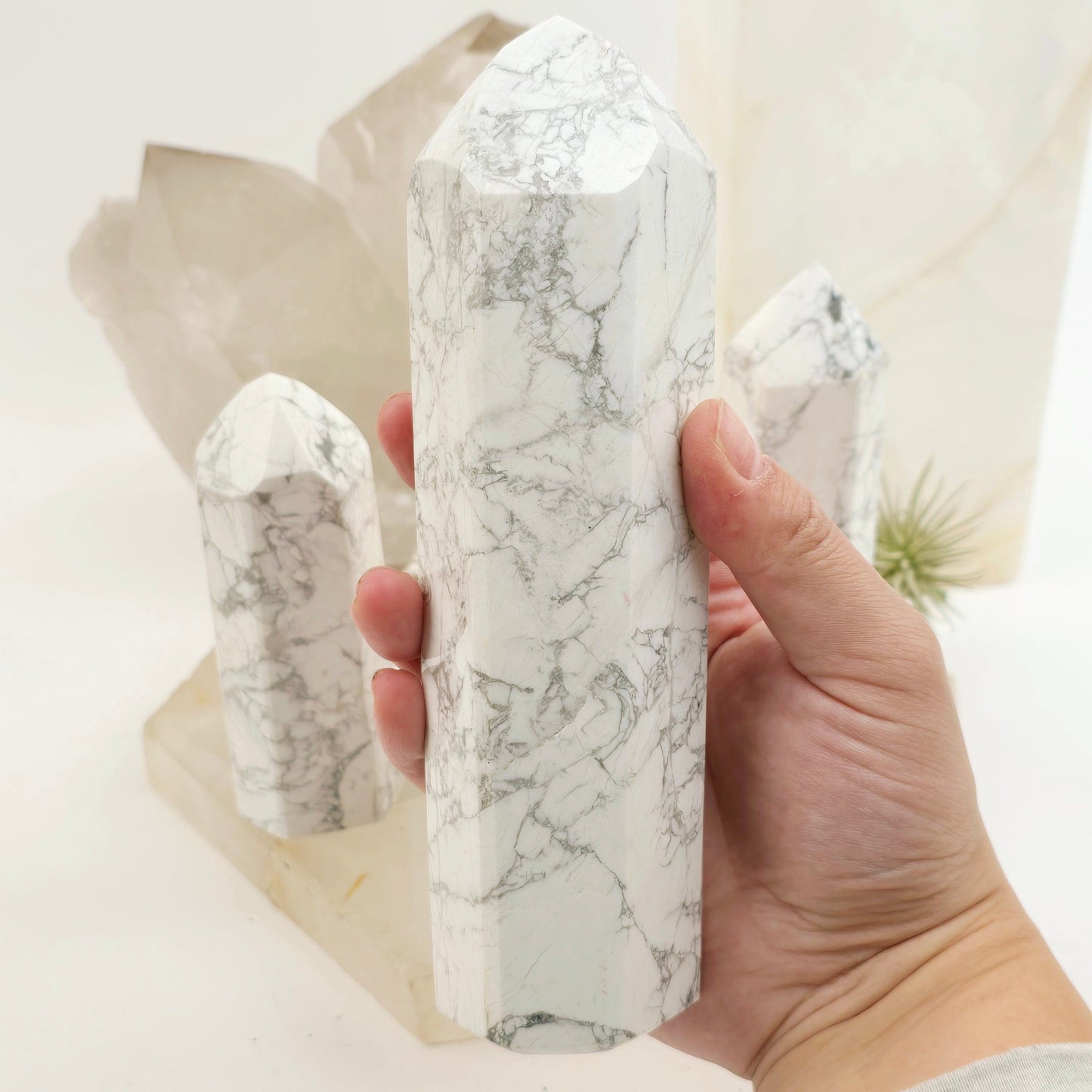 White Howlite Crystal Obelisk - You Choose #1 variant 3 in hand for size reference with other variants in the background