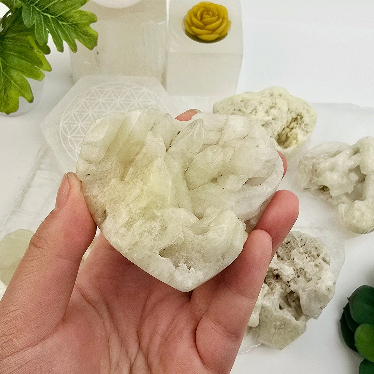 Sulfur Quartz Polished Crystal Cluster Heart - You Choose #1 variant 4 in hand for size reference with other variants in the background