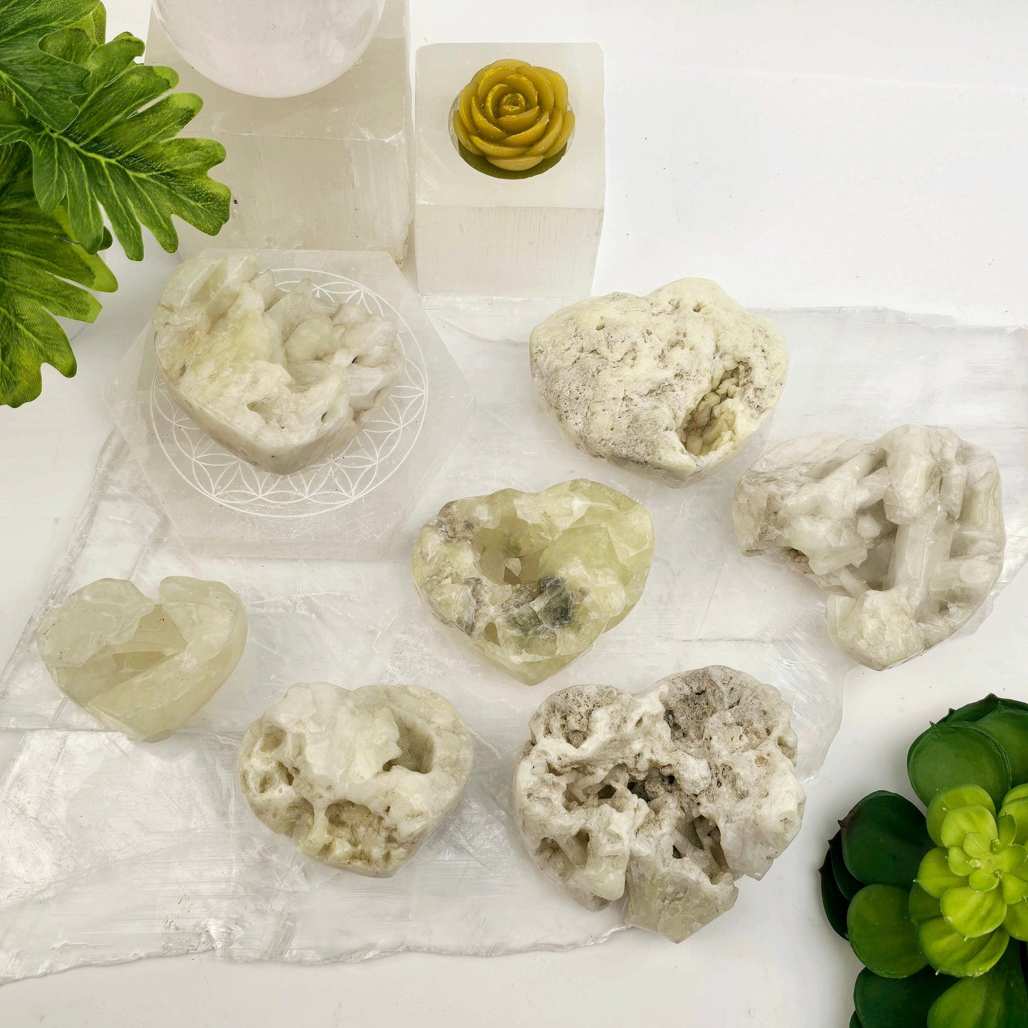 Sulfur Quartz Polished Crystal Cluster Heart - You Choose #1 all variants top view with props and plants in the background