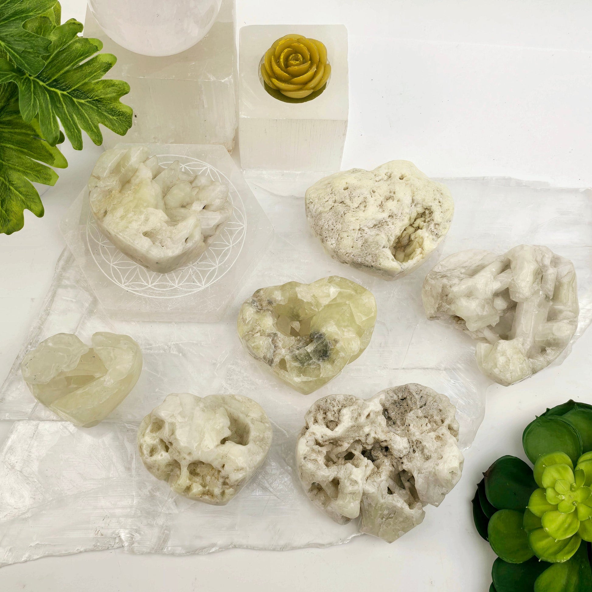 Sulfur Quartz Polished Crystal Cluster Heart - You Choose #1 all variants top view with props and plants in the background