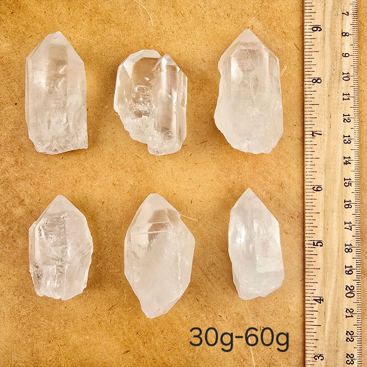 Crystal Quartz Extra Grade Points - By Weight weight 30g-60g variant labeled with ruler for size reference