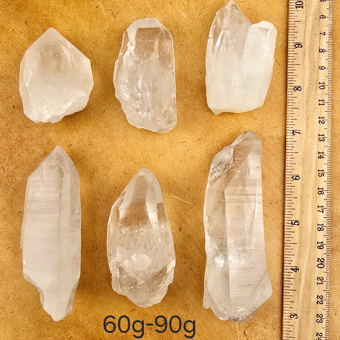 Crystal Quartz Extra Grade Points - By Weight weight 60g-90g variant labeled with ruler for size reference