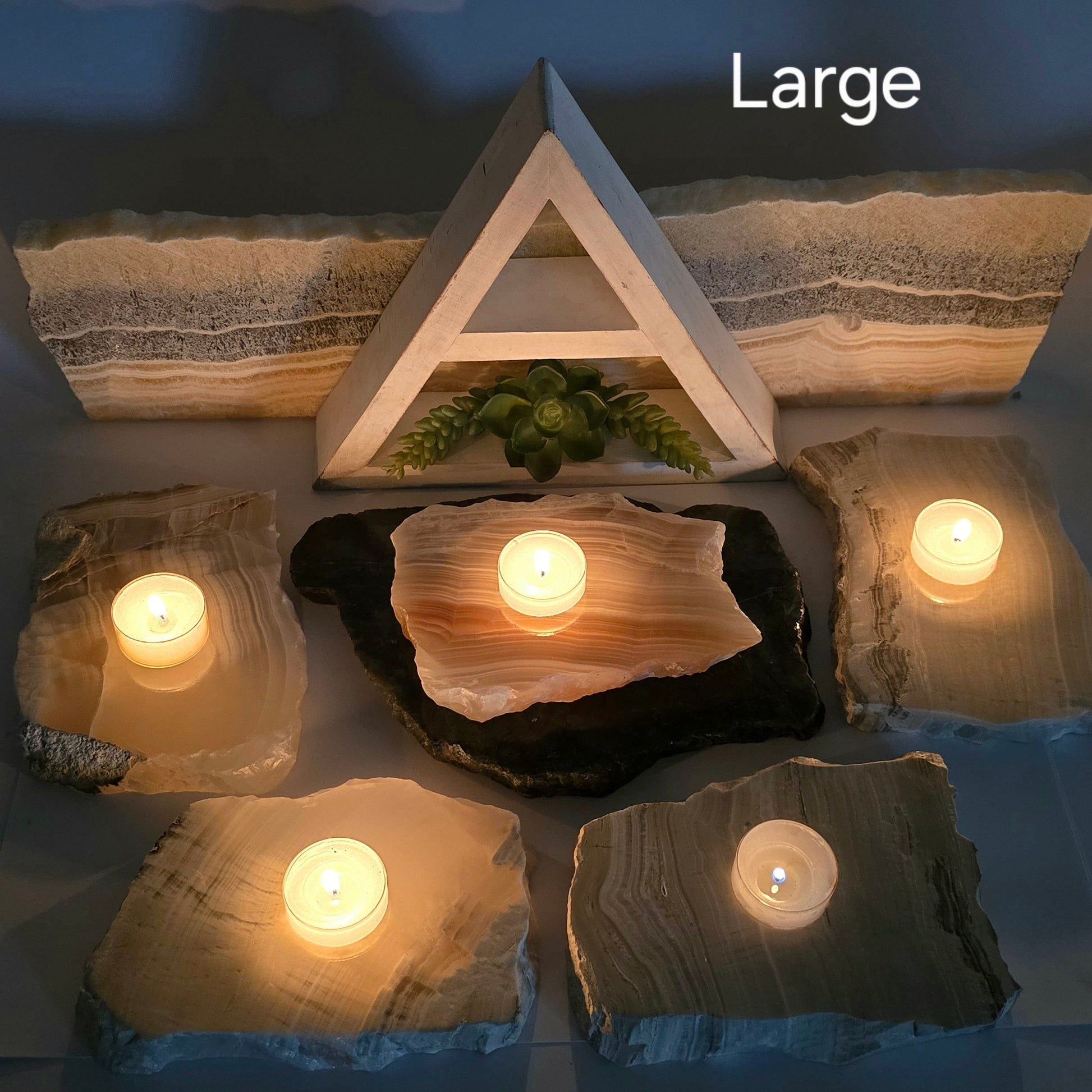 Grey Travertine Calcite - Grey Onyx - Crystal Candle Holder - By Size Large variant labeled dark background with candles lit