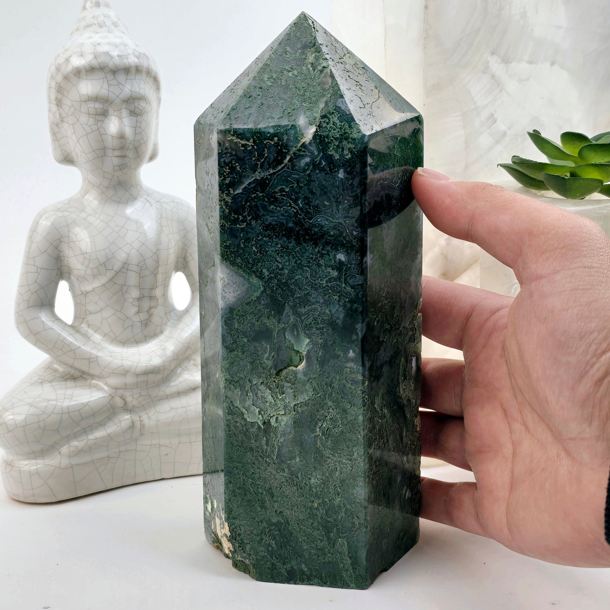 Moss Agate Crystal Obelisk - One-of-a-Kind with hand for size reference front view