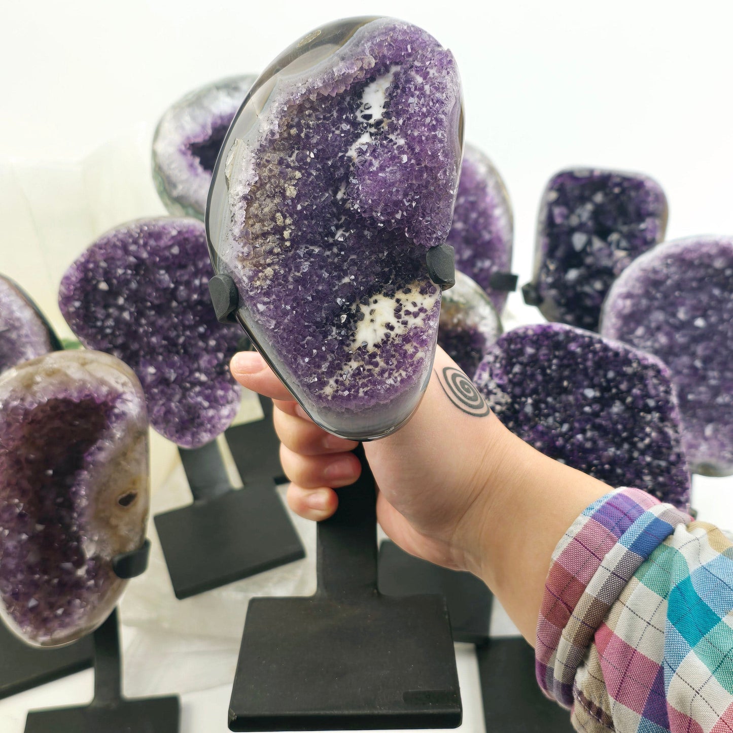 Amethyst Crystal Cluster on Metal Stand from Uruguay - You Choose #1 one variant in hand for size reference with other variants in the background