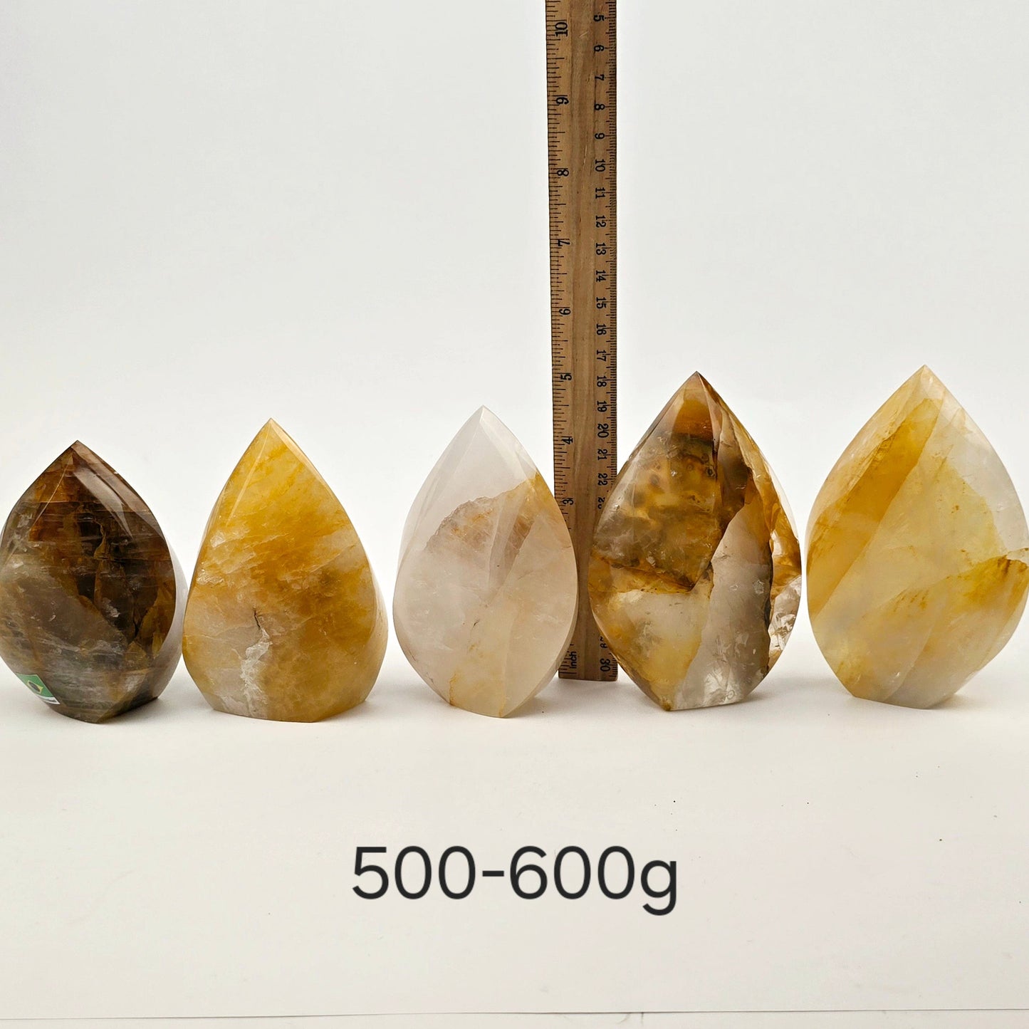 Golden Healer Crystal Flame Point Cut Base - By Weight 500-600g variant labeled with ruler for size reference