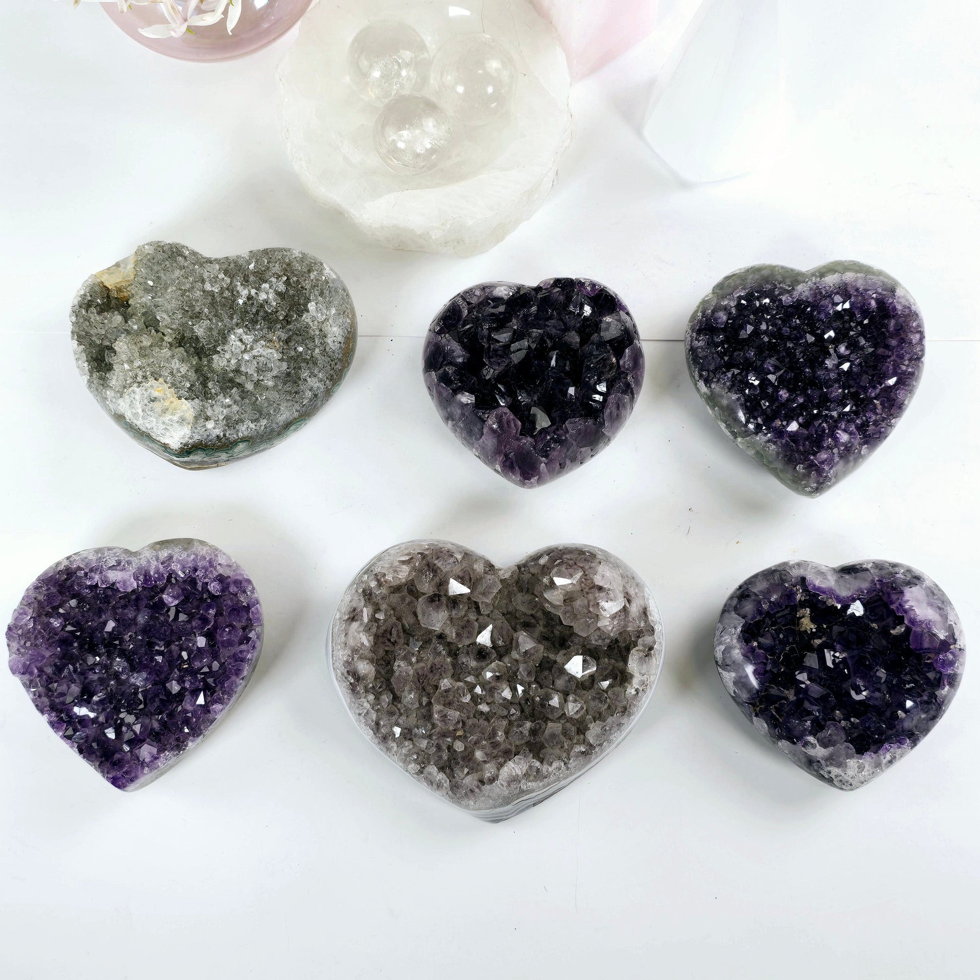 Amethyst Crystal Heart - You Choose #3 all variants top view with props and plants in the background