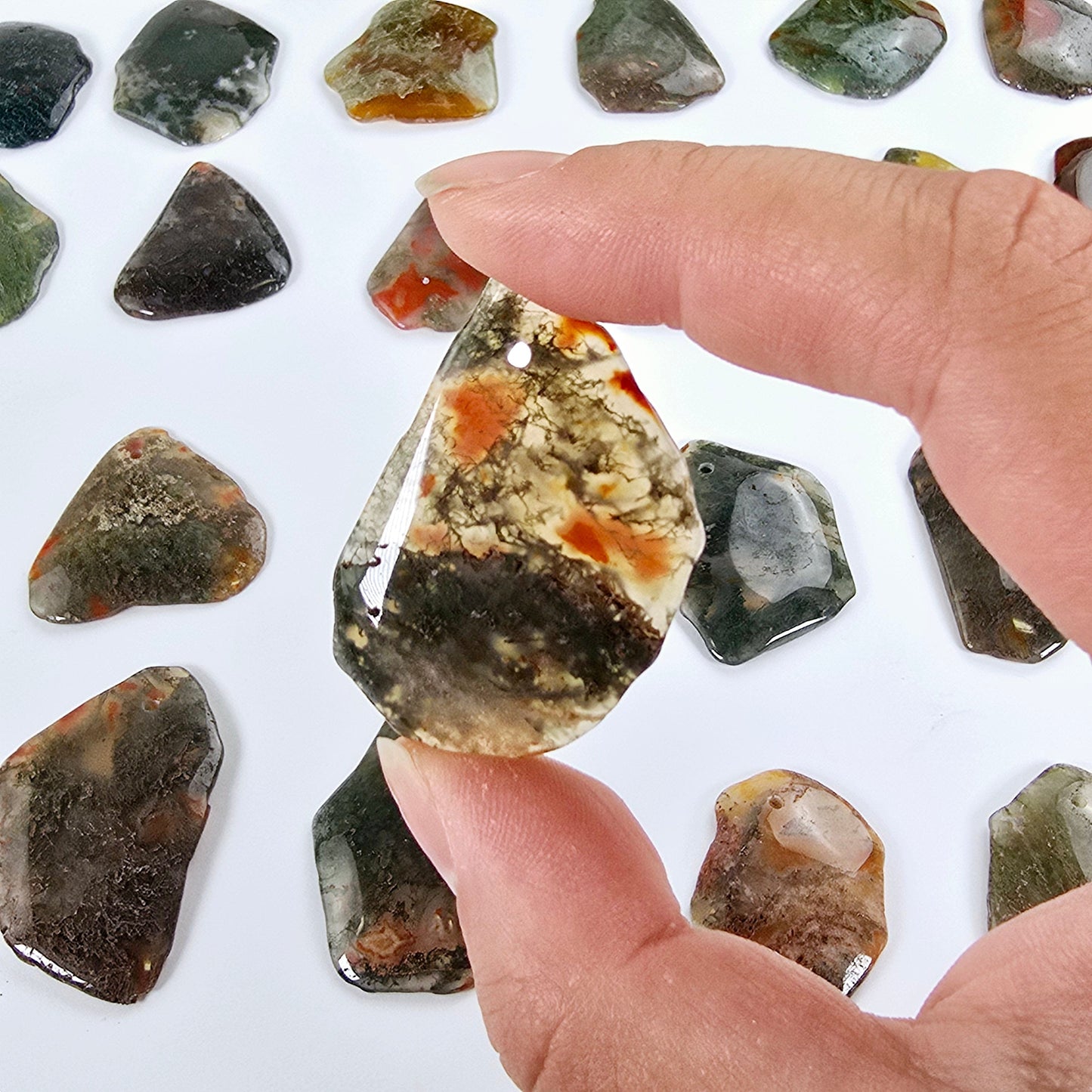 Moss Agate Freeform Crystal Pendant - Top Front Drilled - You Choose #1 one variant in hand for size reference with other variants in the background