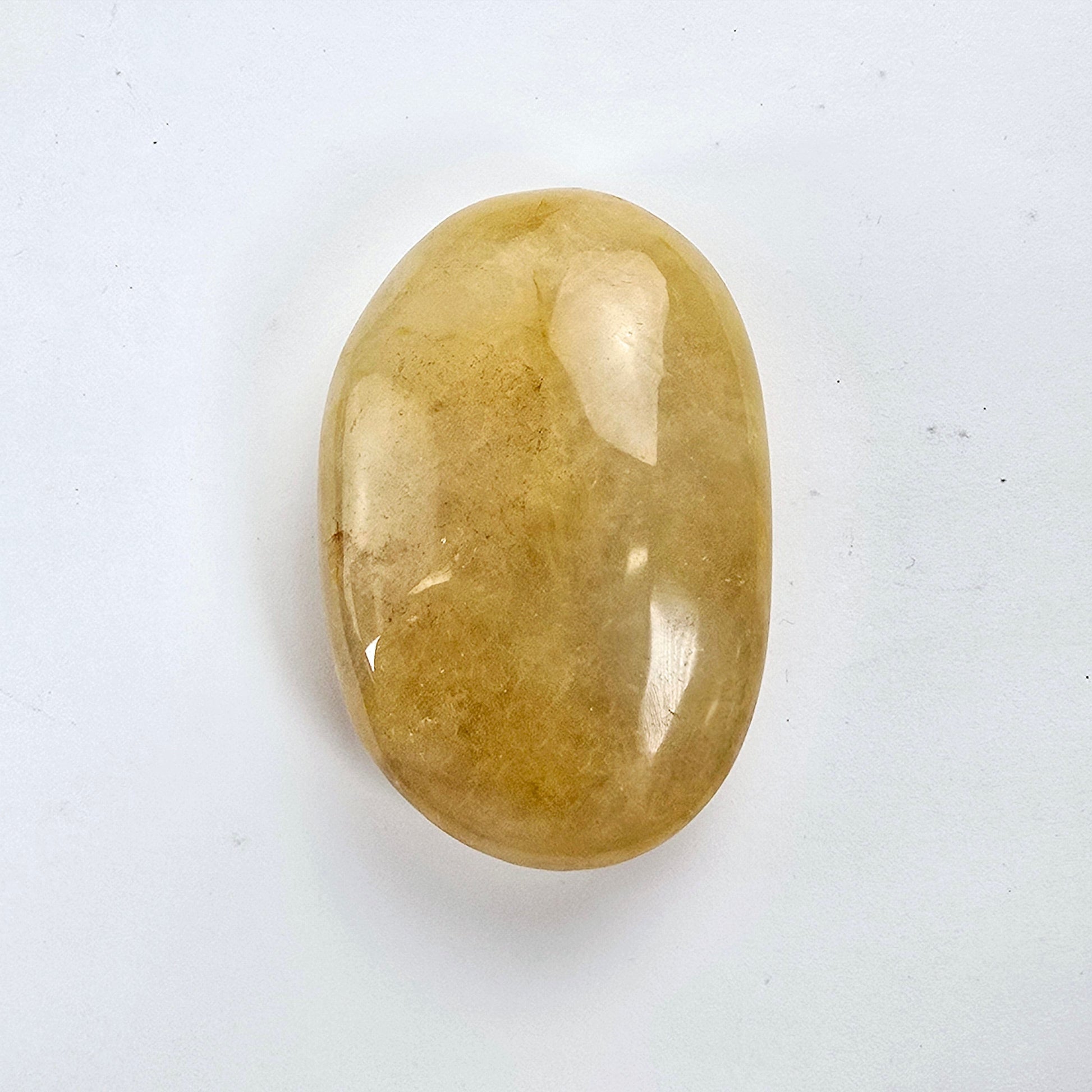 Golden Healer Crystal Palm Stone one top view