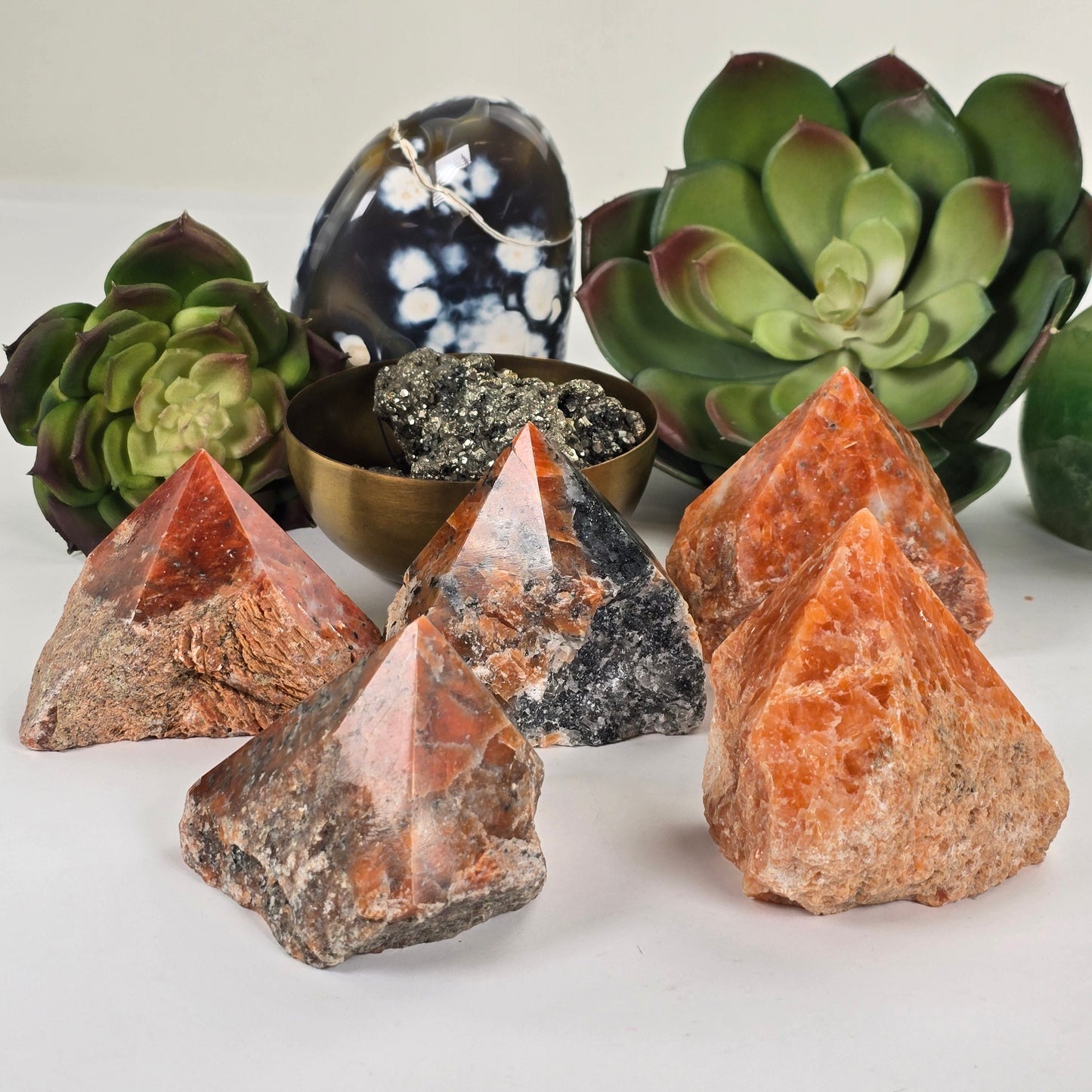 Orchid Calcite Semi Polished Crystal Point - You Choose all variants with plants and props in the background