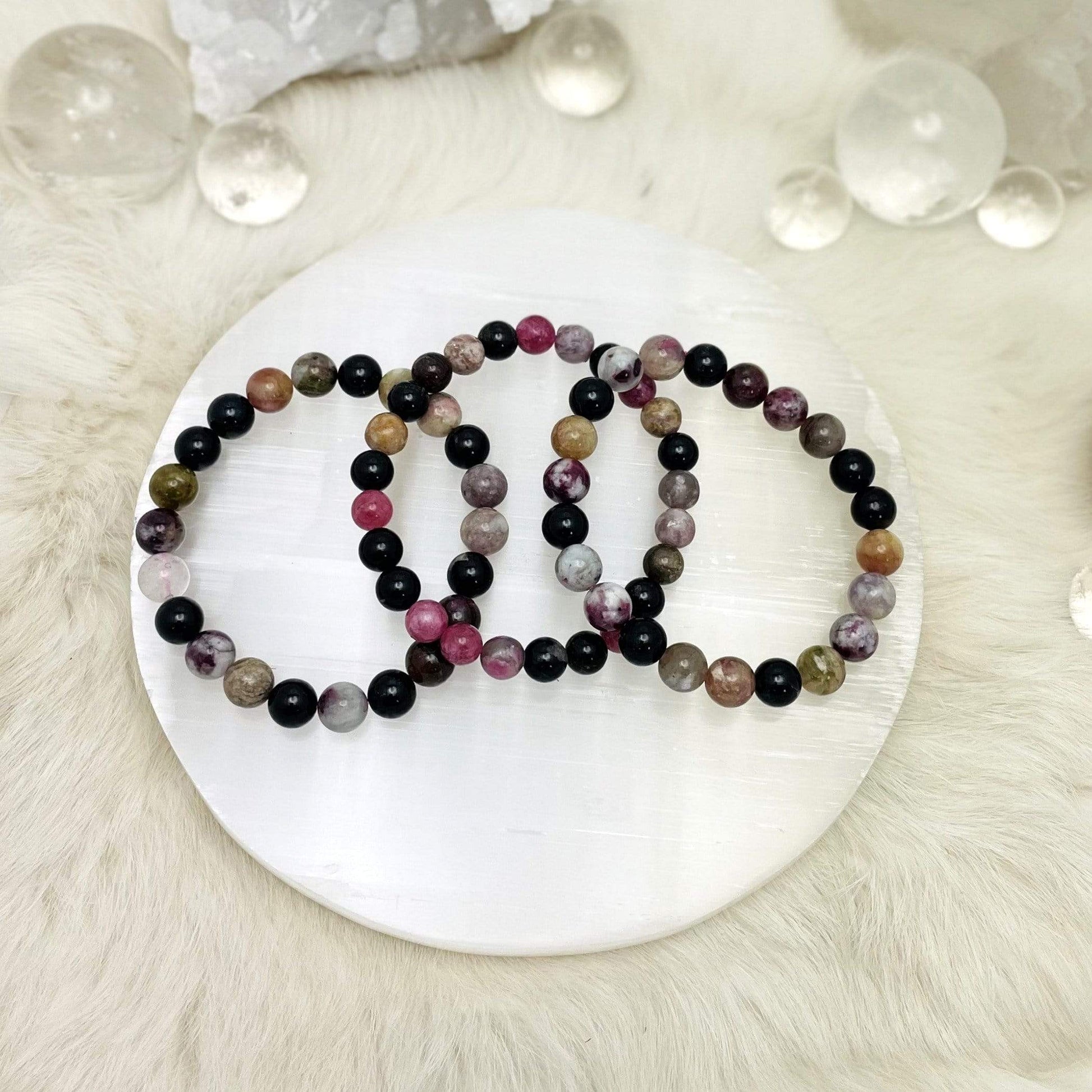 3 Products Watermelon Tourmaline Round Bead Bracelets on a selenite plate 