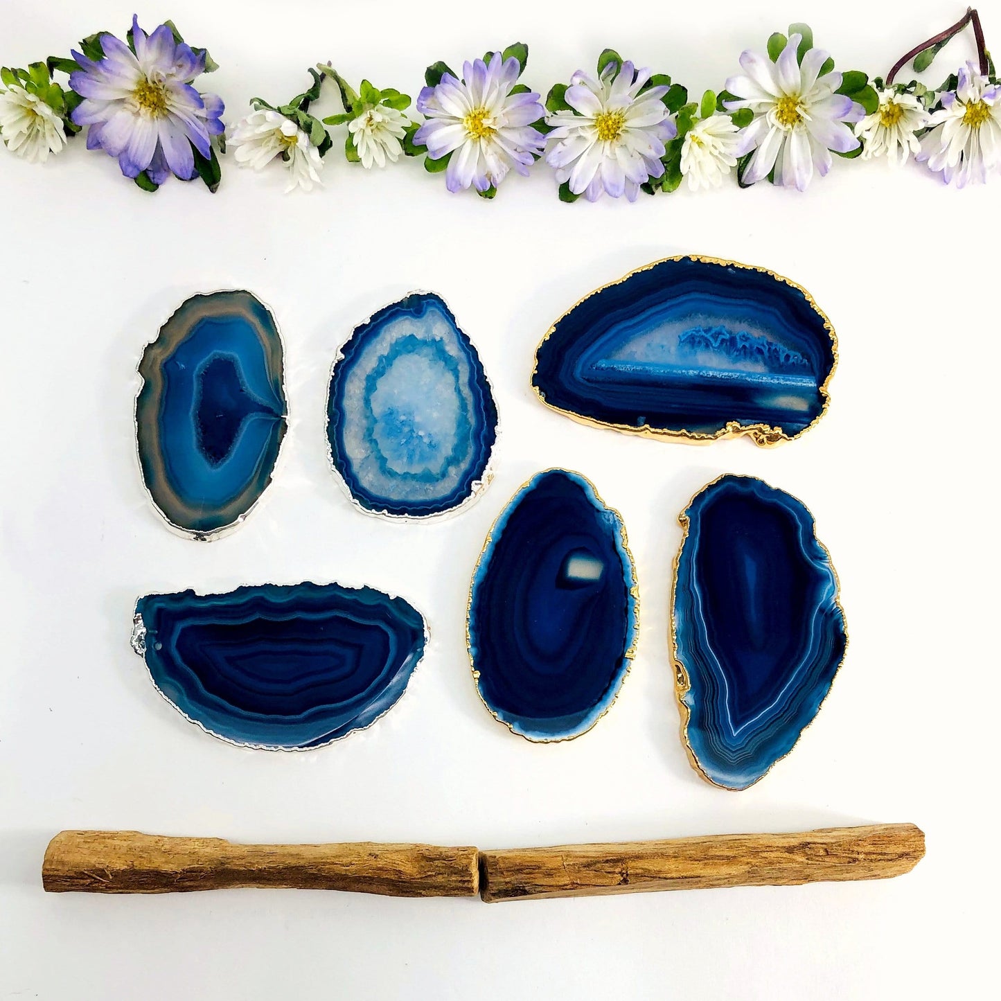 Picture of our blue plated  agate slices being displayed on a white back ground. 