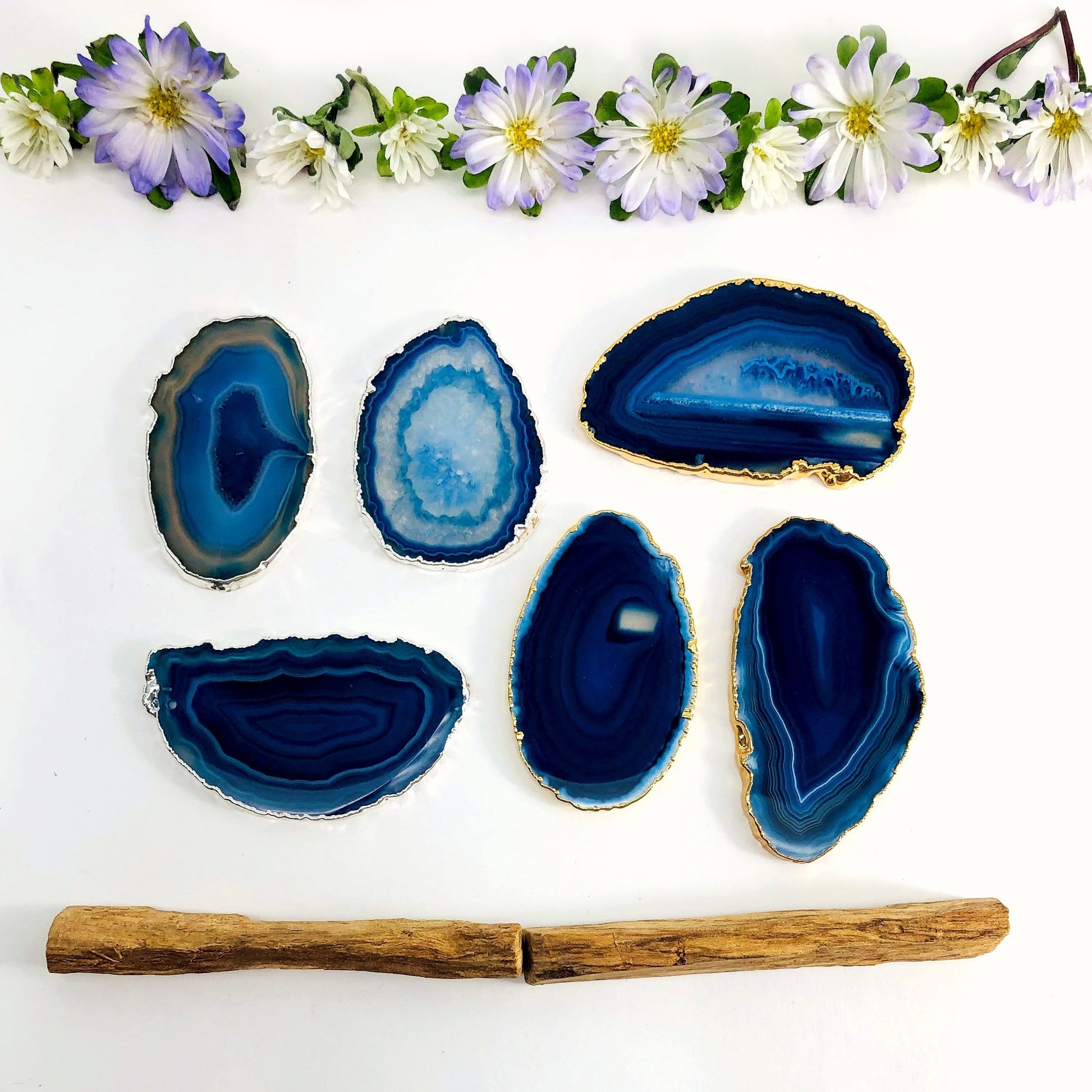 Picture of our blue plated  agate slices being displayed on a white back ground. 
