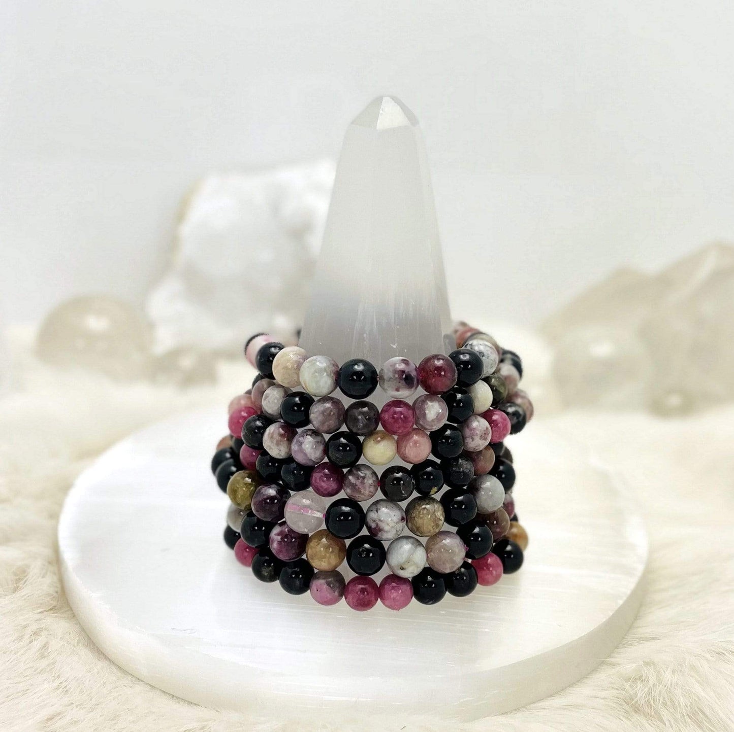 7 Products Watermelon Tourmaline Round Bead Bracelets on a selenite tower 