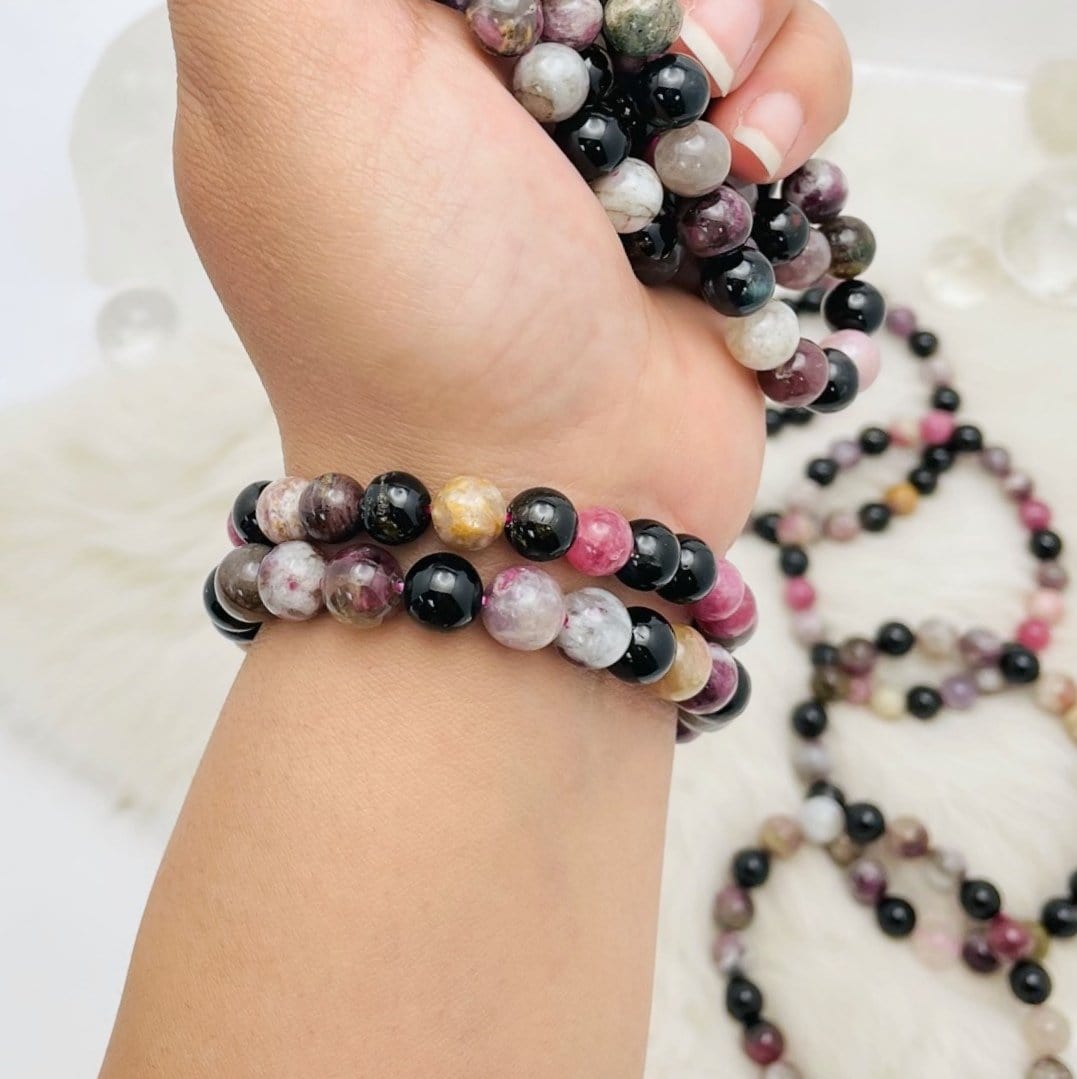 2 Products Watermelon Tourmaline Round Bead Bracelets on wrist for size reference 