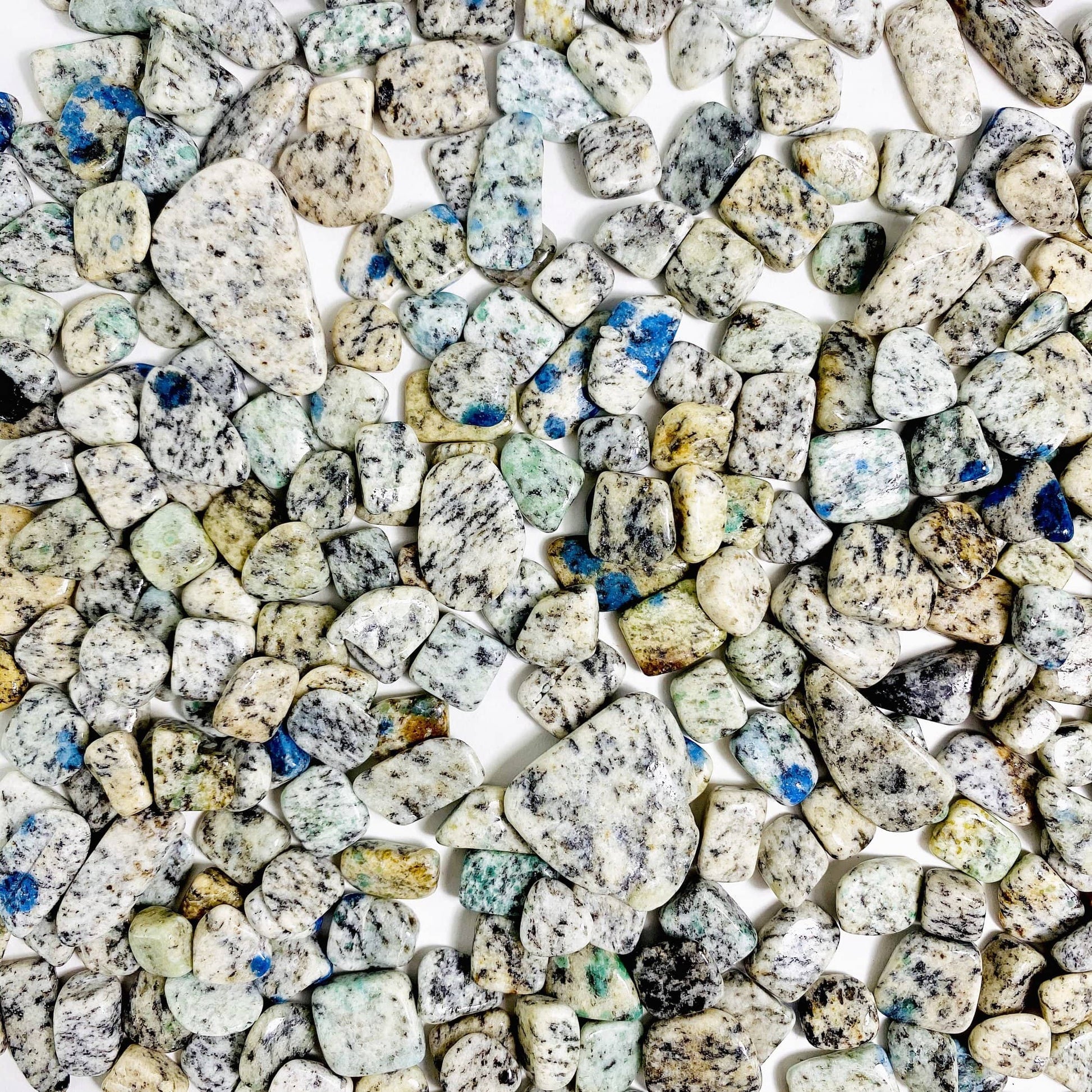  K2 Jasper Chips displayed up close to show various colors patterns lengths sizes and over all characteristics