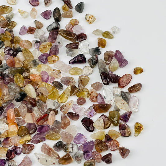 Seven Minerals in One Tumbled Chips displayed to show the differences in the sizes and color shades 