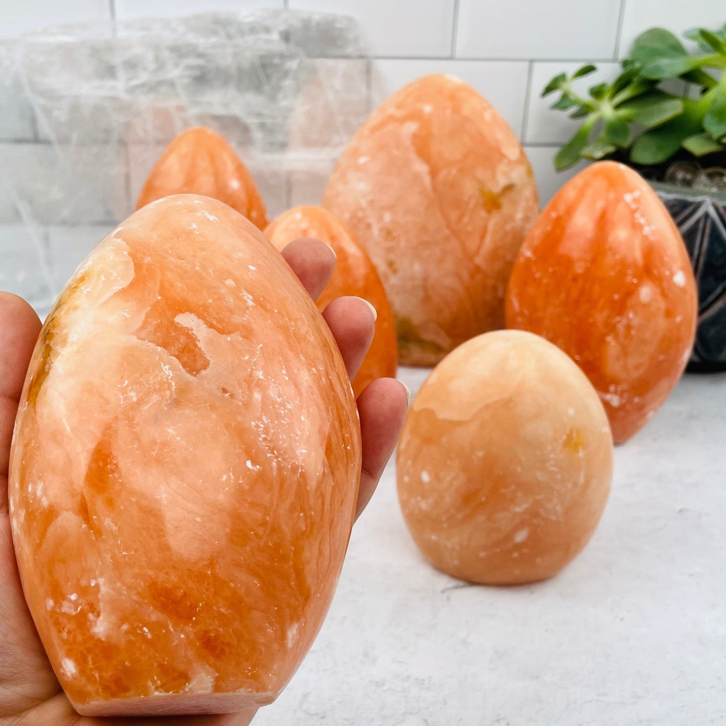 Peach Aventurine Cut Base in hand for size reference 