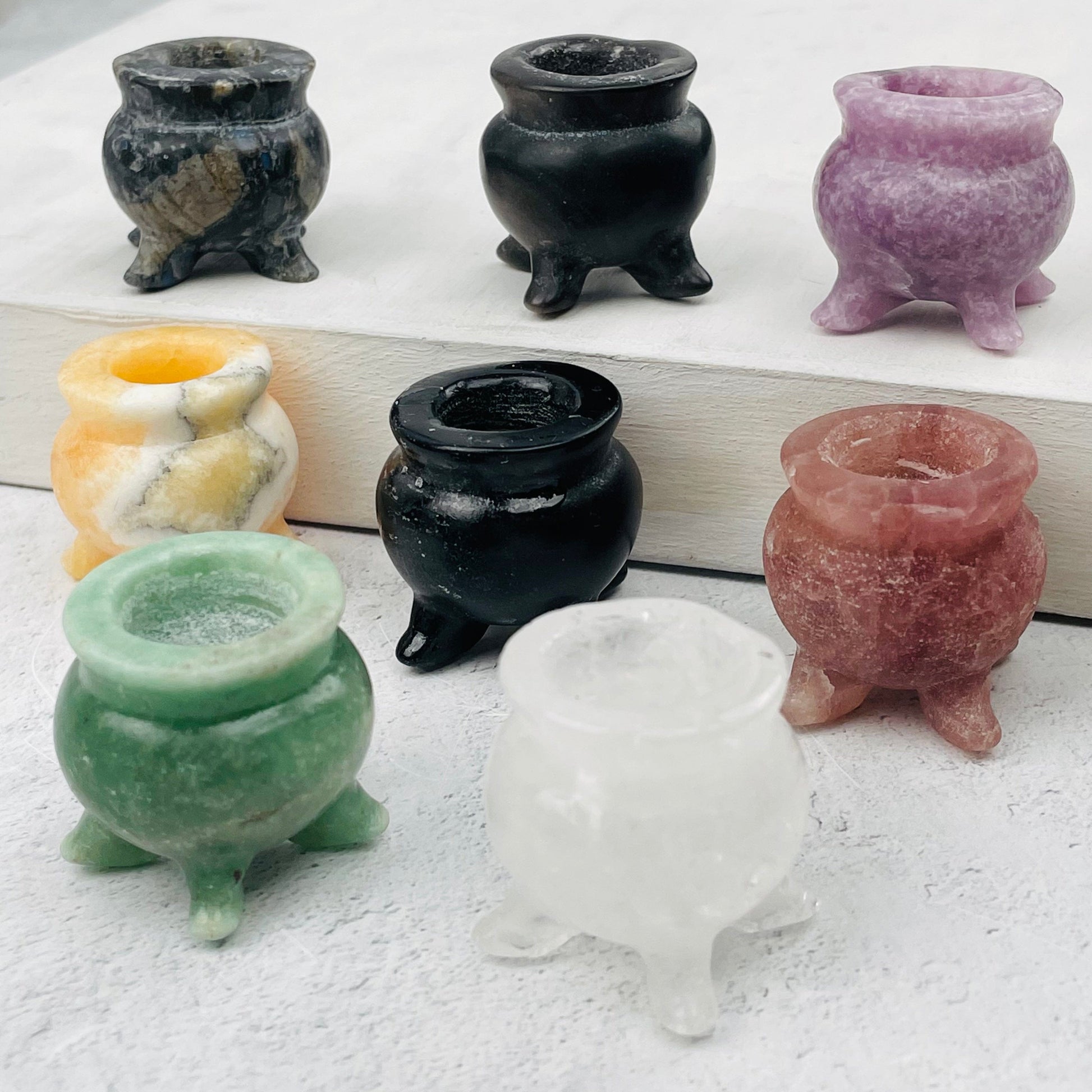 cauldrons displayed to show the differences in the crystal types 