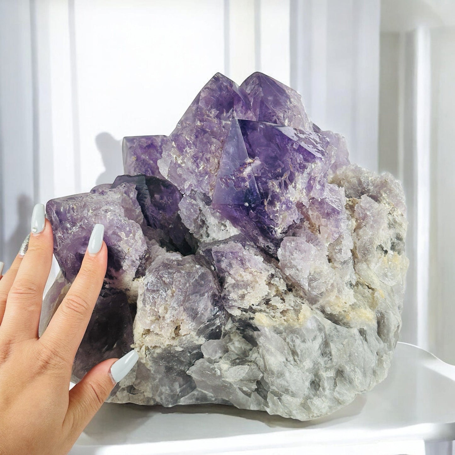 Giant Elestial Amethyst Crystal Cluster from Brazil - Rare Find with hand for size reference
