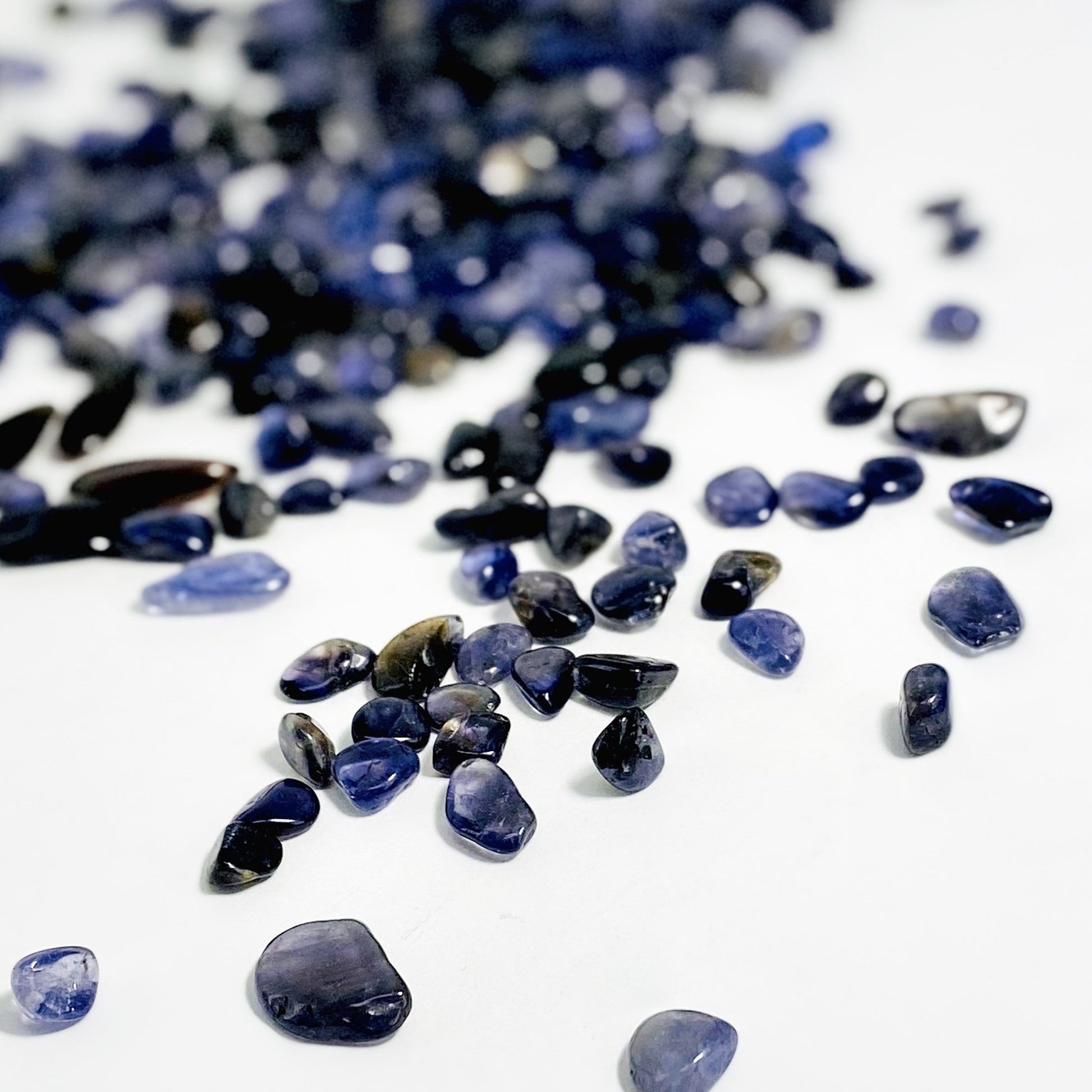 1lb Bag of Iolite Chips spread out showing side view up close