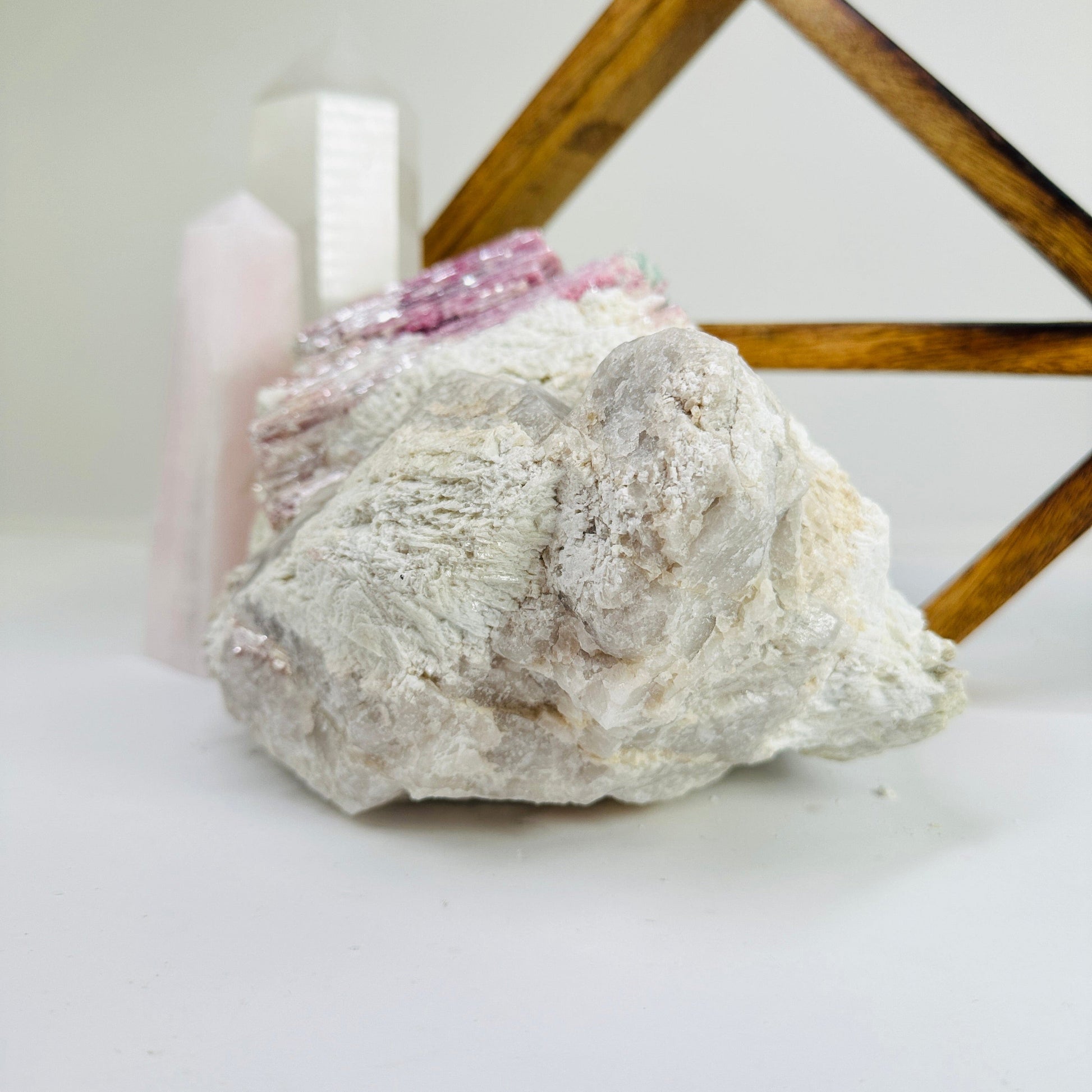 watermelon tourmaline with decorations in the background
