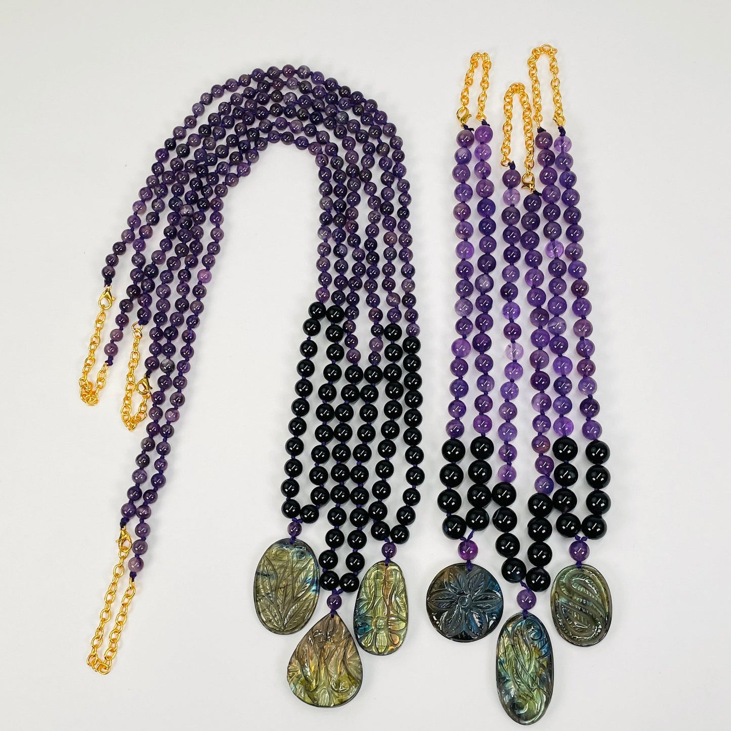 multiple necklaces displayed to show the two options available. sizes are adjustable. option A is 16" - 18" and option B is 32" - 36"