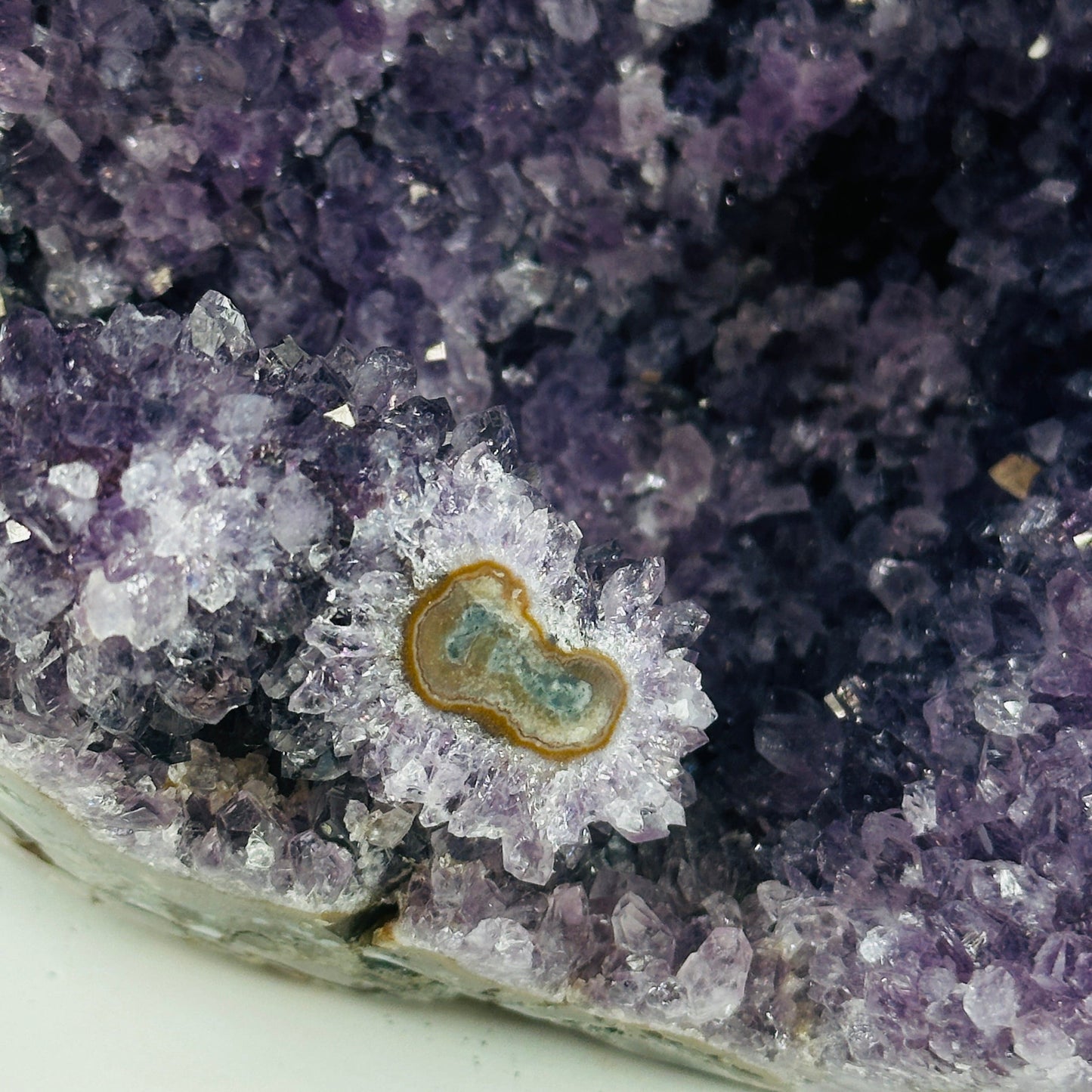 amethyst cut base with decorations in the background