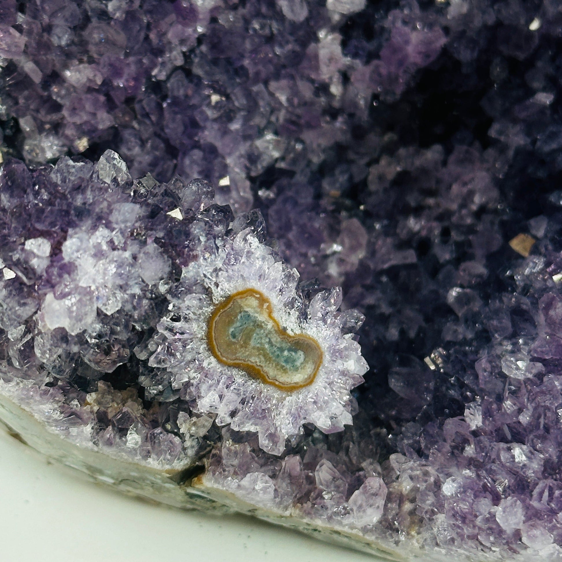 amethyst cut base with decorations in the background