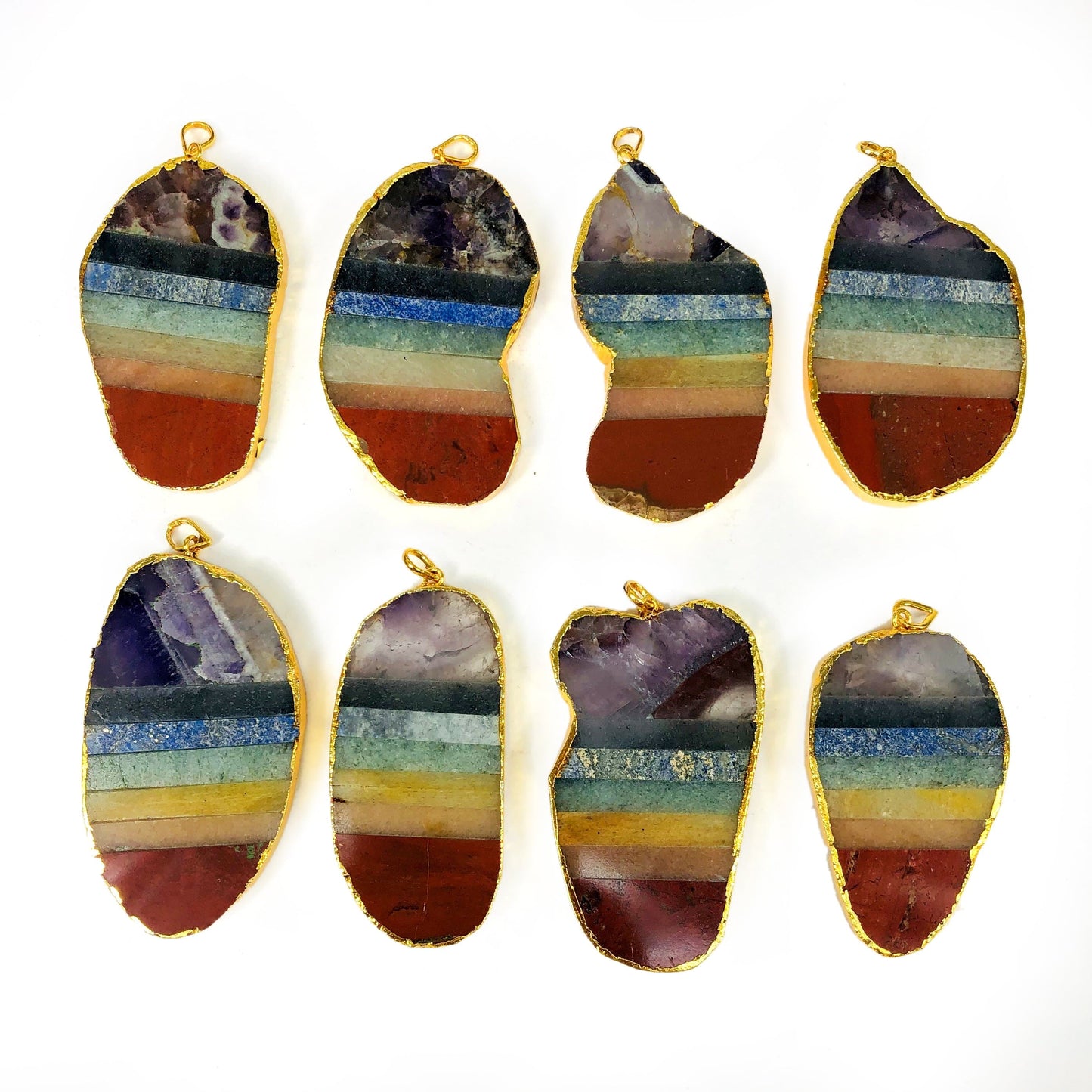close up of the details on the gold electroplated chakra pendants