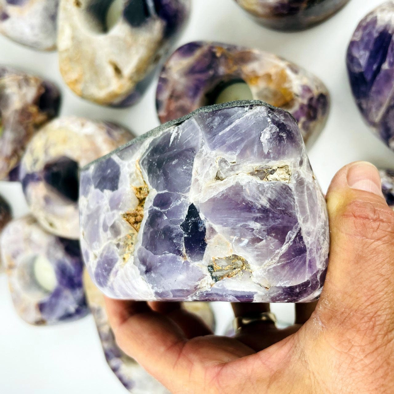 Chevron Amethyst Polished Candle Holder up close view of the side with natural stone markings and divots