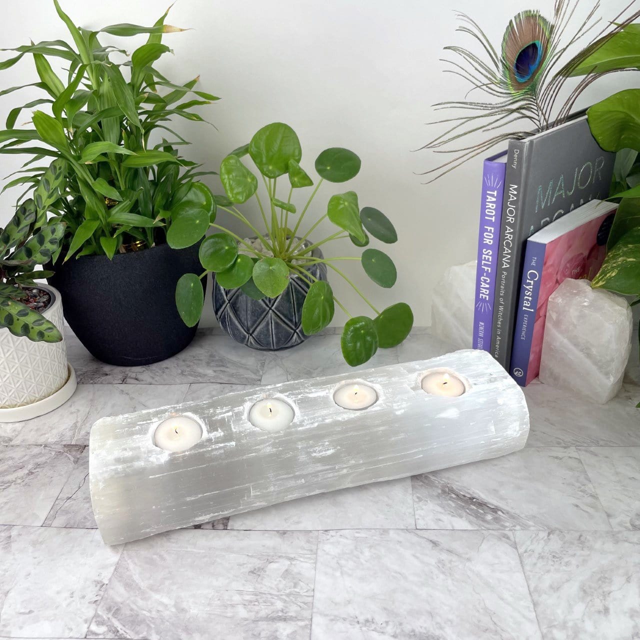 4 votive selenite candle holder on display