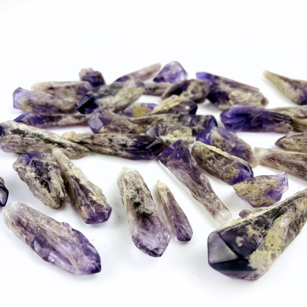 Elestial Amethyst Point - 1 Pound Bag shown from a side view