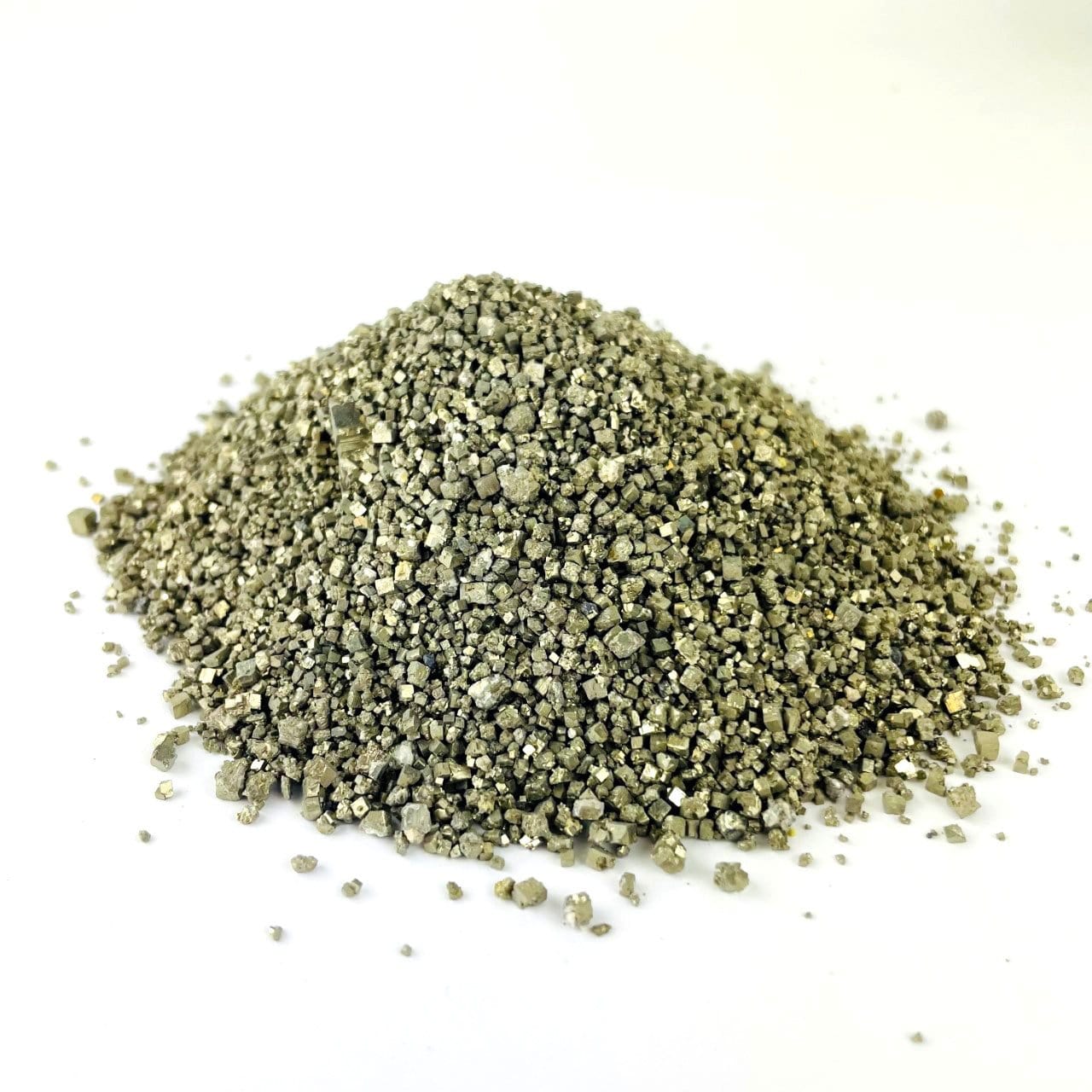 Side view of a pile of Pyrite Dust displayed on a white surface.