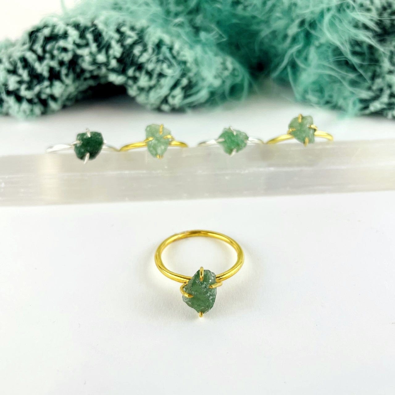 close up of the green aventurine gemstone rings. available in gold or silver 