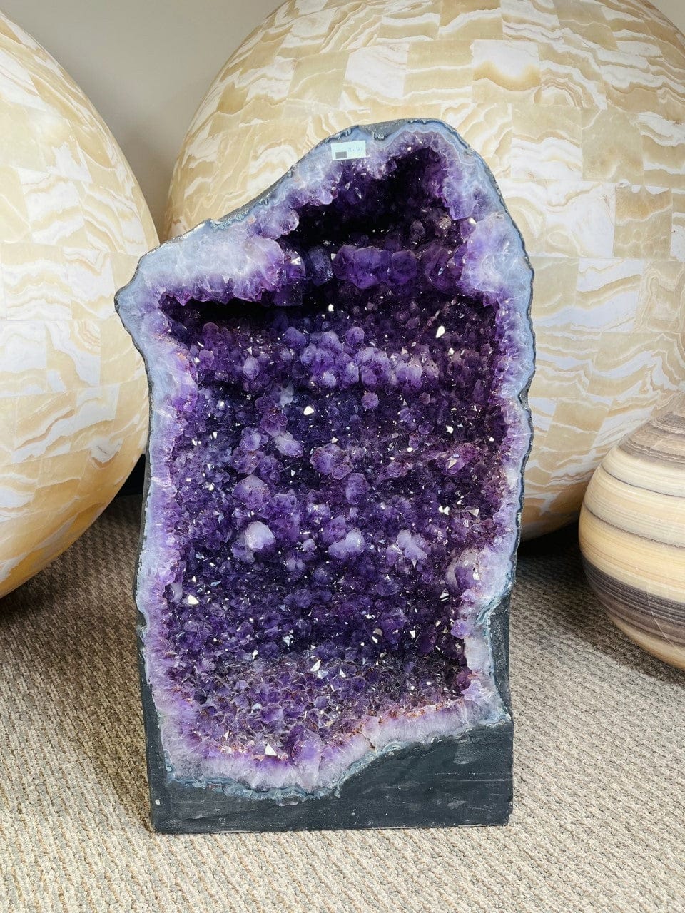 Amethyst Crystal Cathedral Geode on display 