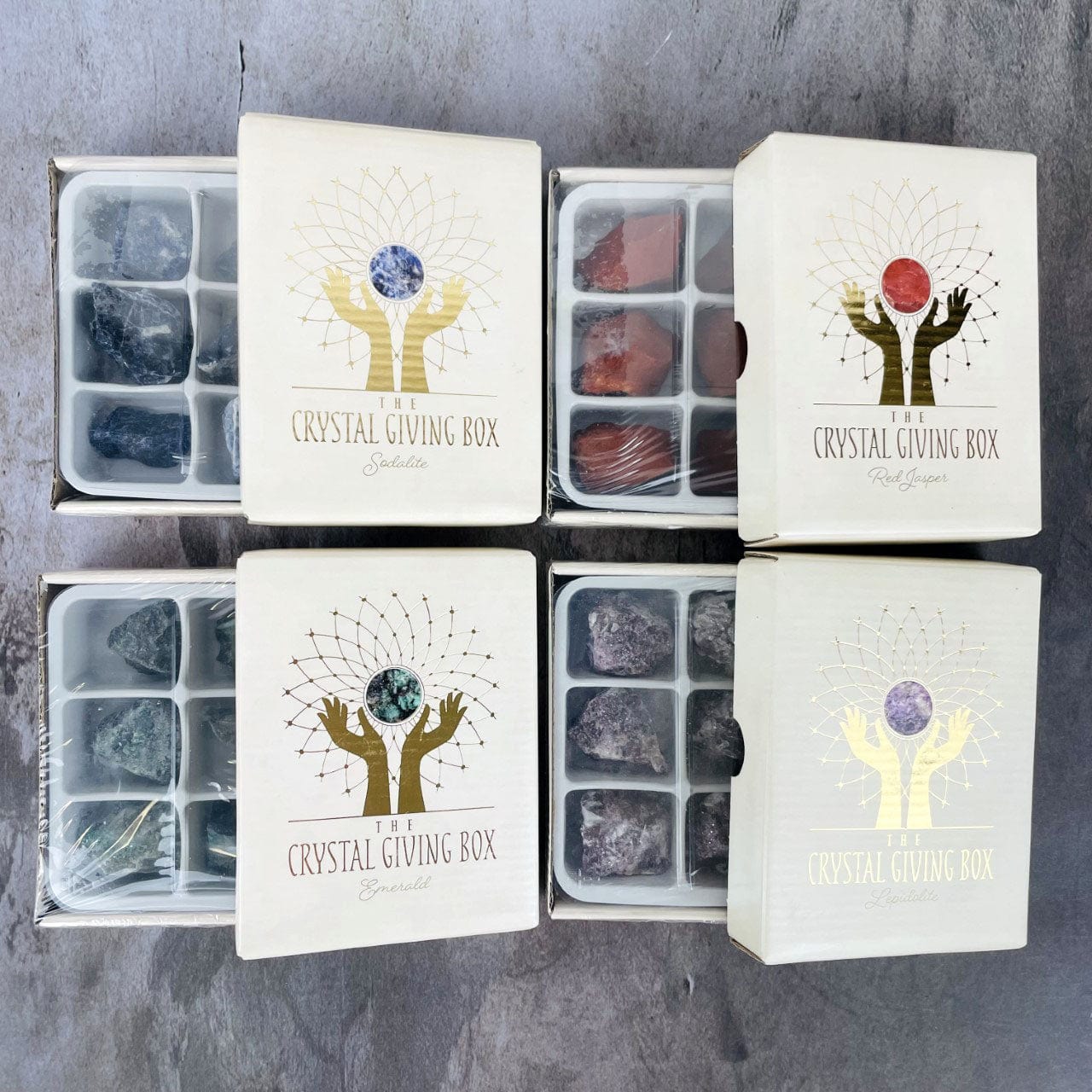 4 open boxes showing the 6 stones inside 