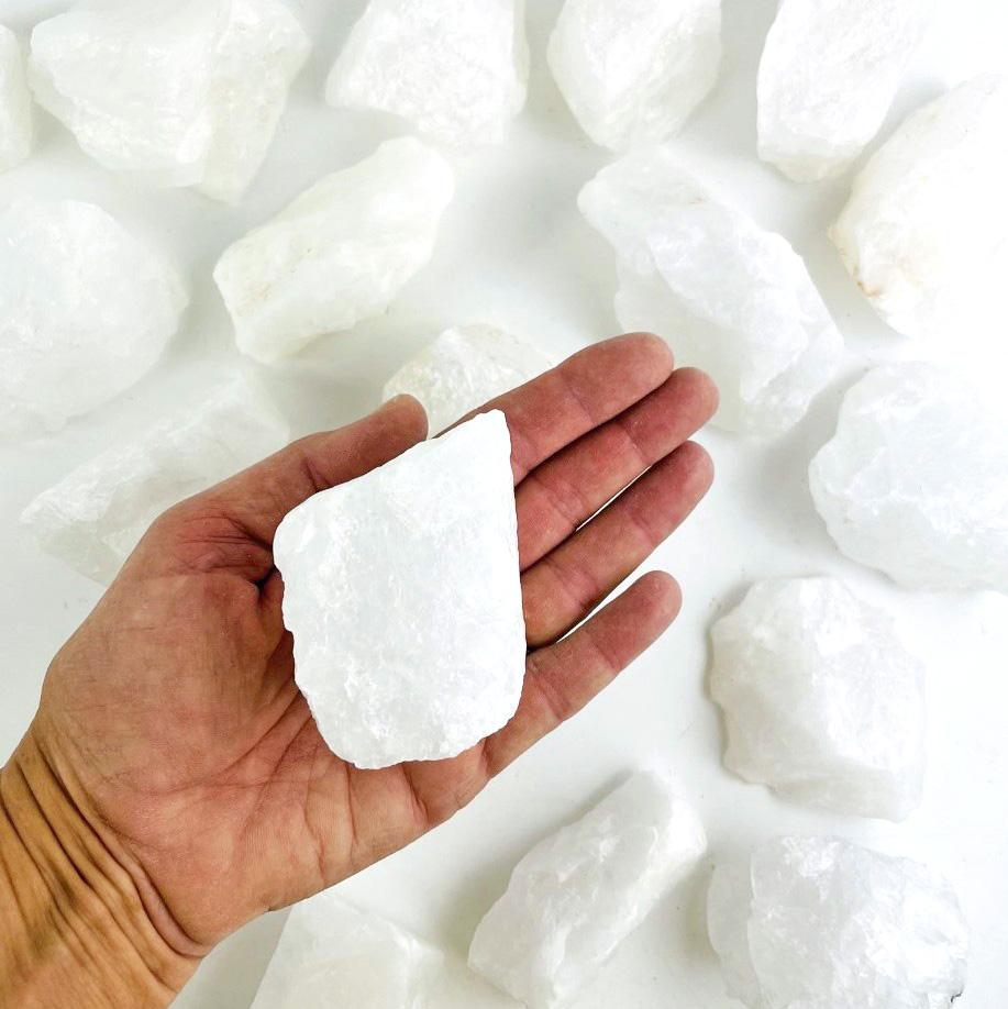 crystal quartz stone in hand 