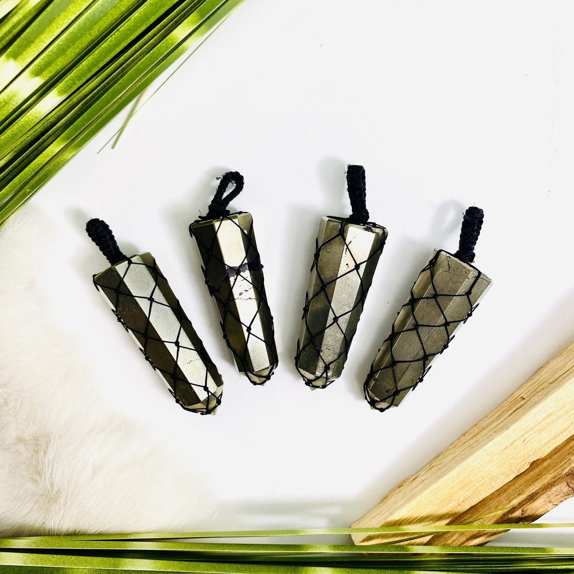 4 netted pyrite pendants close up