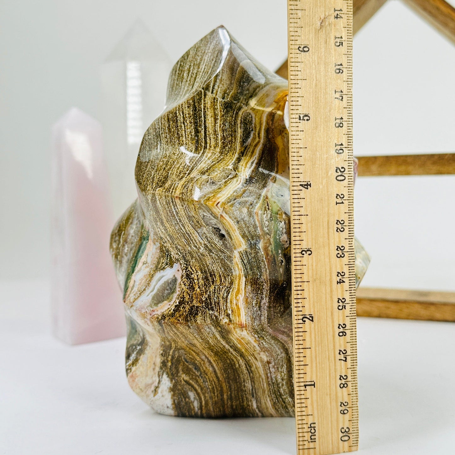 ocean jasper flame point next to a ruler for size reference