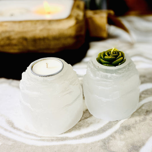 two selenite tower candle holders on display with candles (not included with purchase)