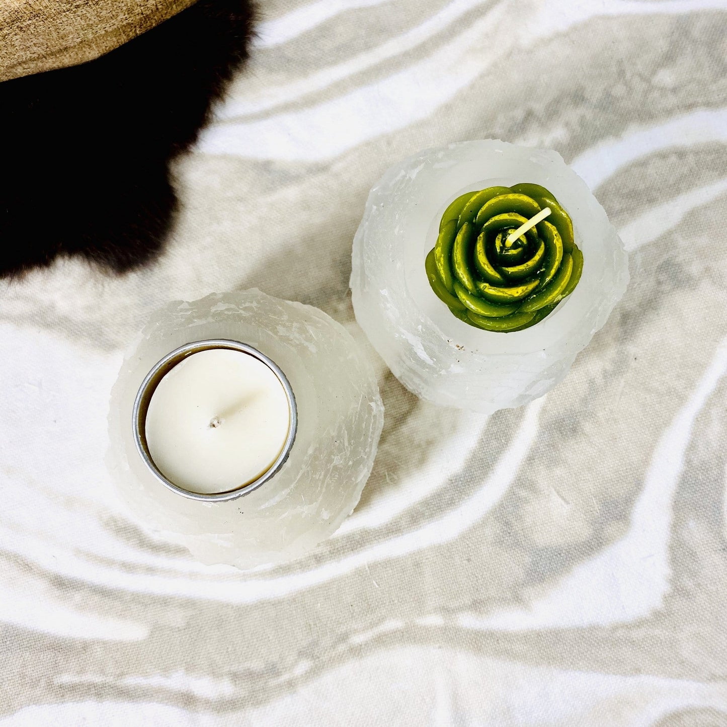 overhead view of two selenite tower candle holders with candles (not included with purchase) for details