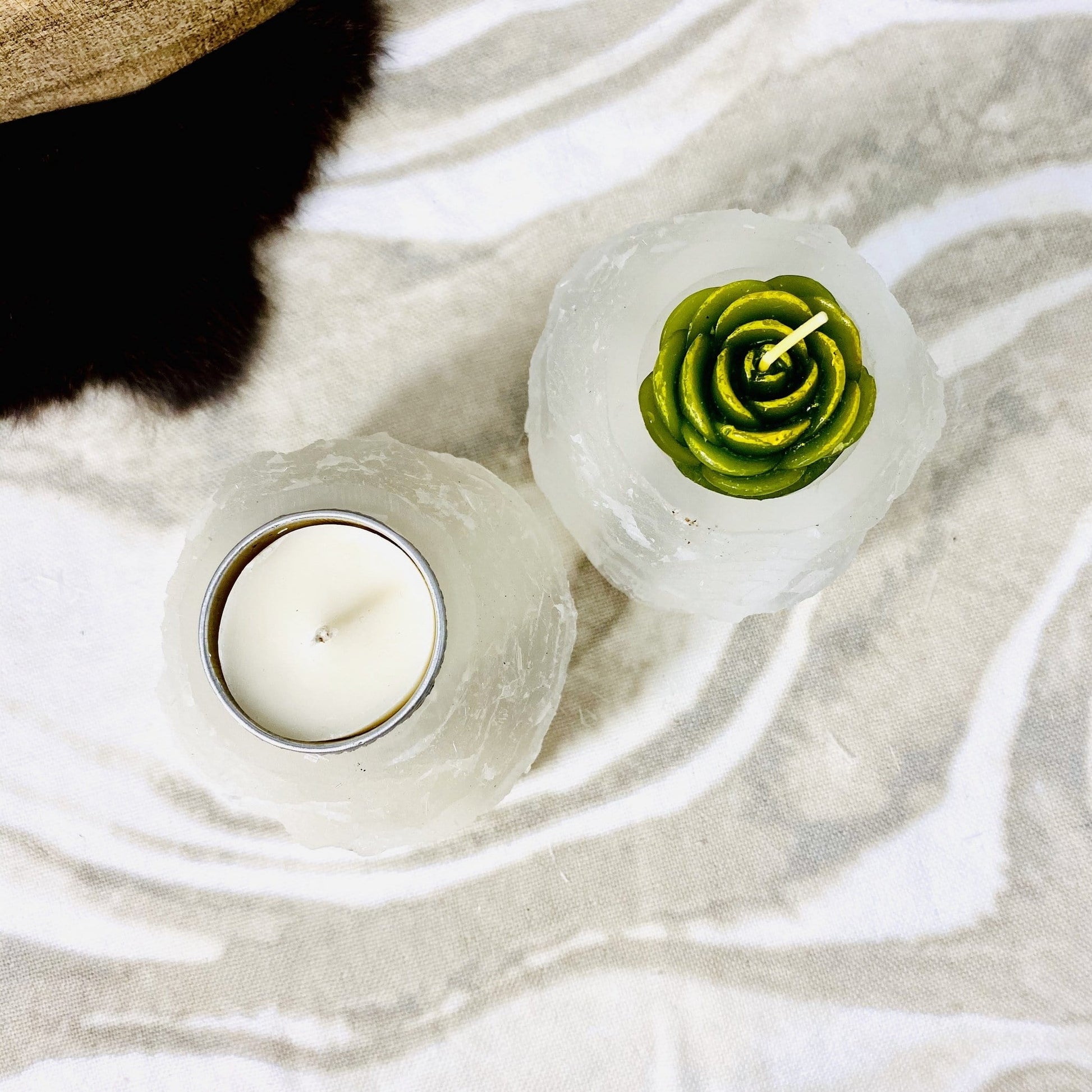 overhead view of two selenite tower candle holders with candles (not included with purchase) for details
