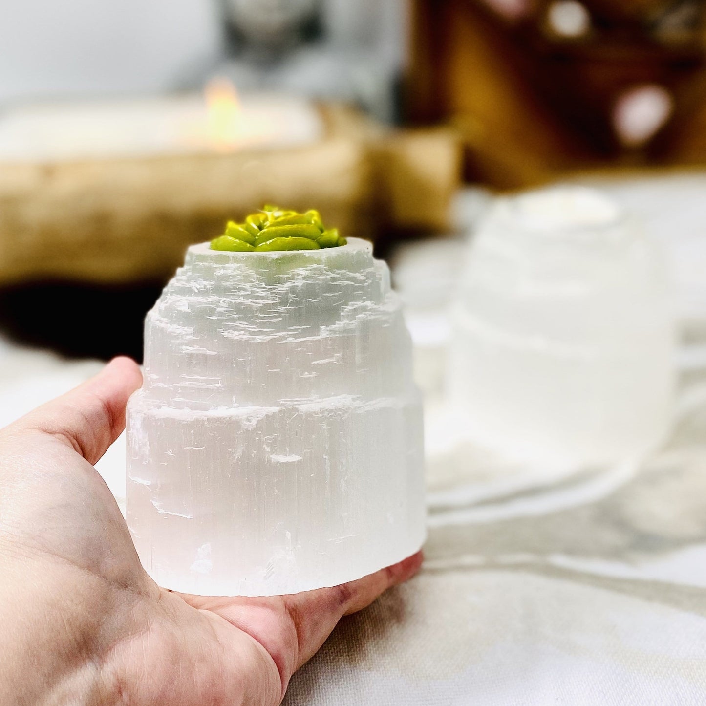 selenite tower candle holder in hand for size reference