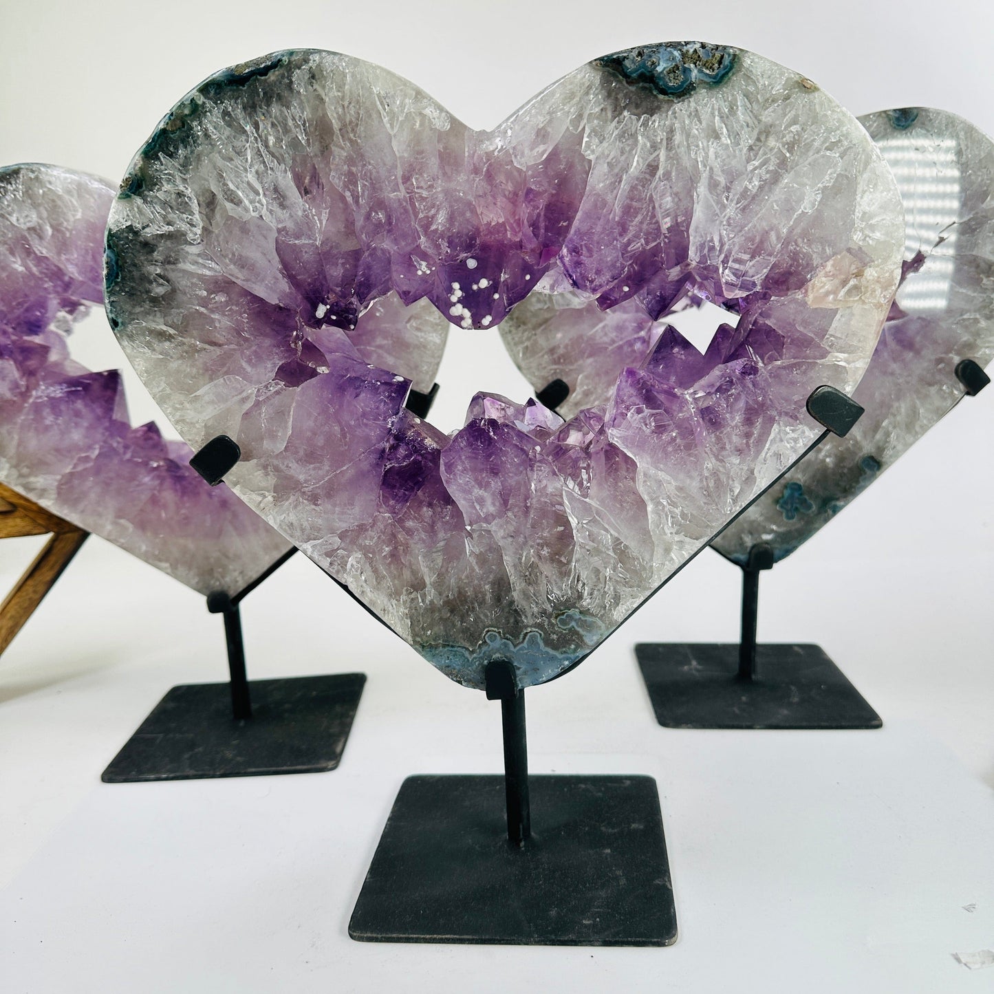 amethyst hearts on stand with decorations in the background