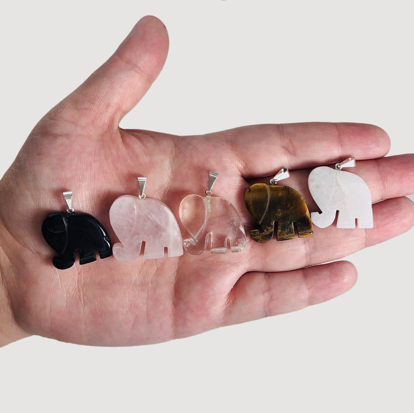 Elephant Gemstones Pendants with their different Stones on a hand 